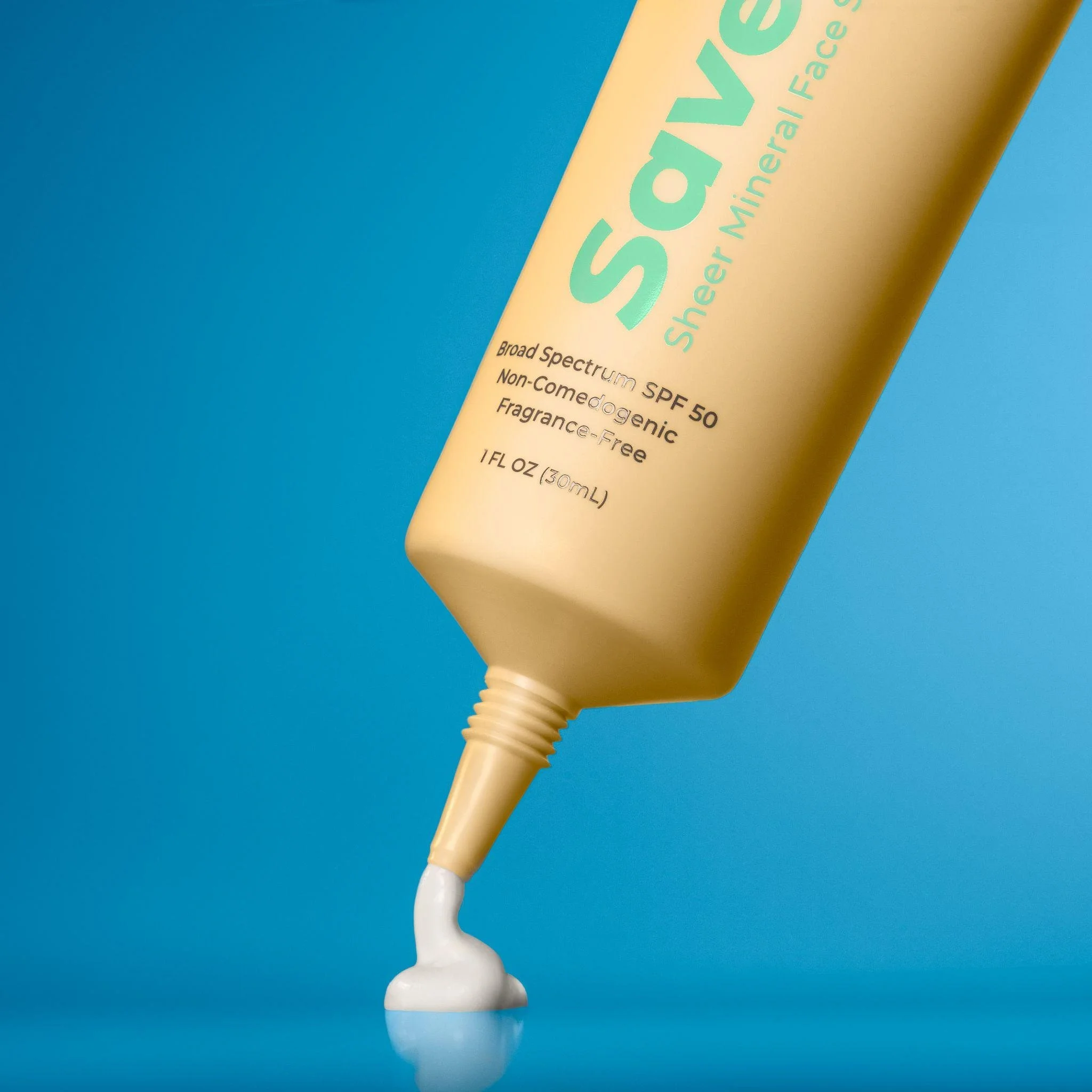 Capture smooth textures being dispensed from a skincare tube to showcase quality and application in close-up photography.