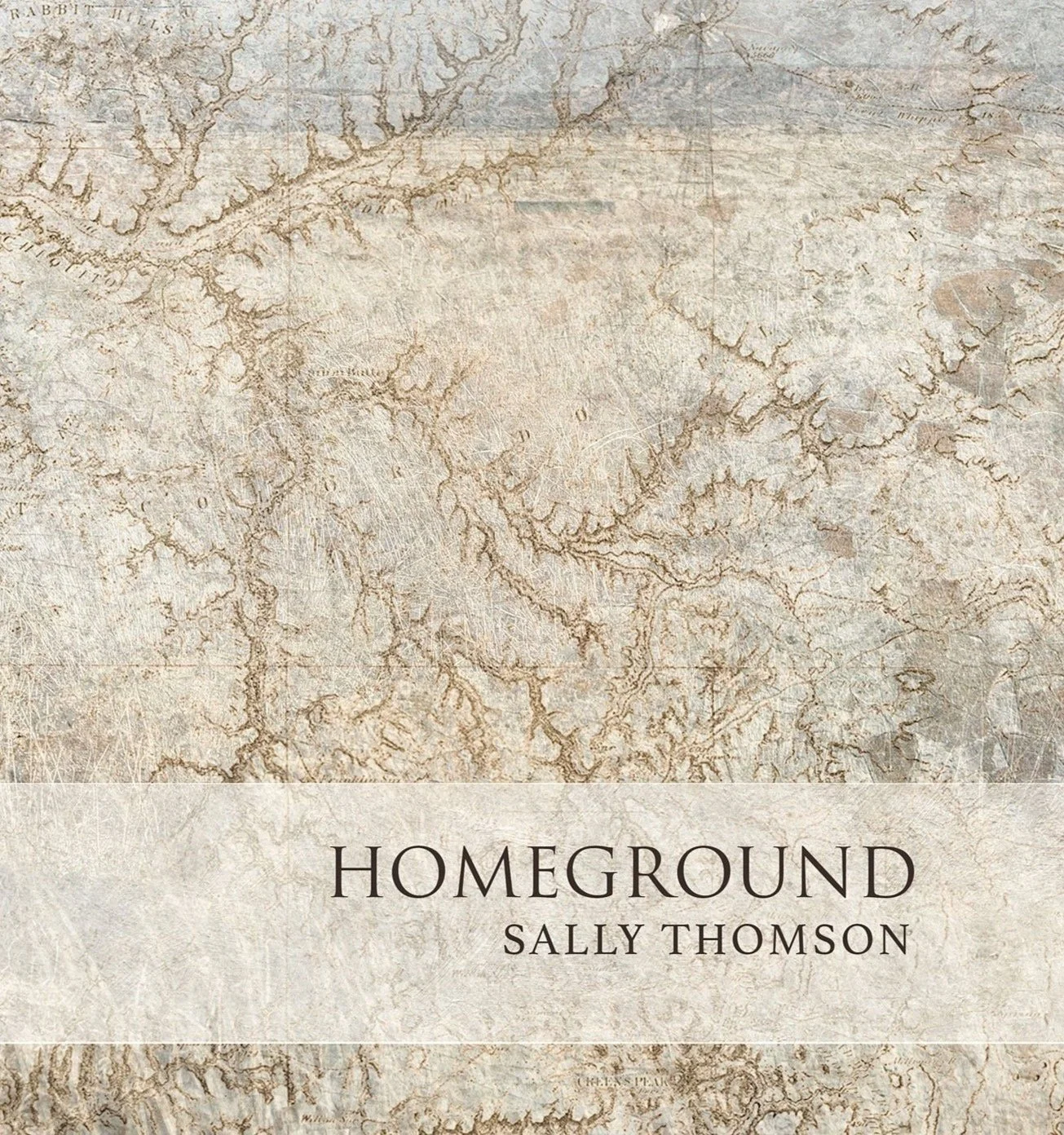 Book cover titled "Homeground" by Sally Thomson, featuring a textured background resembling an old map with earthy tones and faint geographical lines.