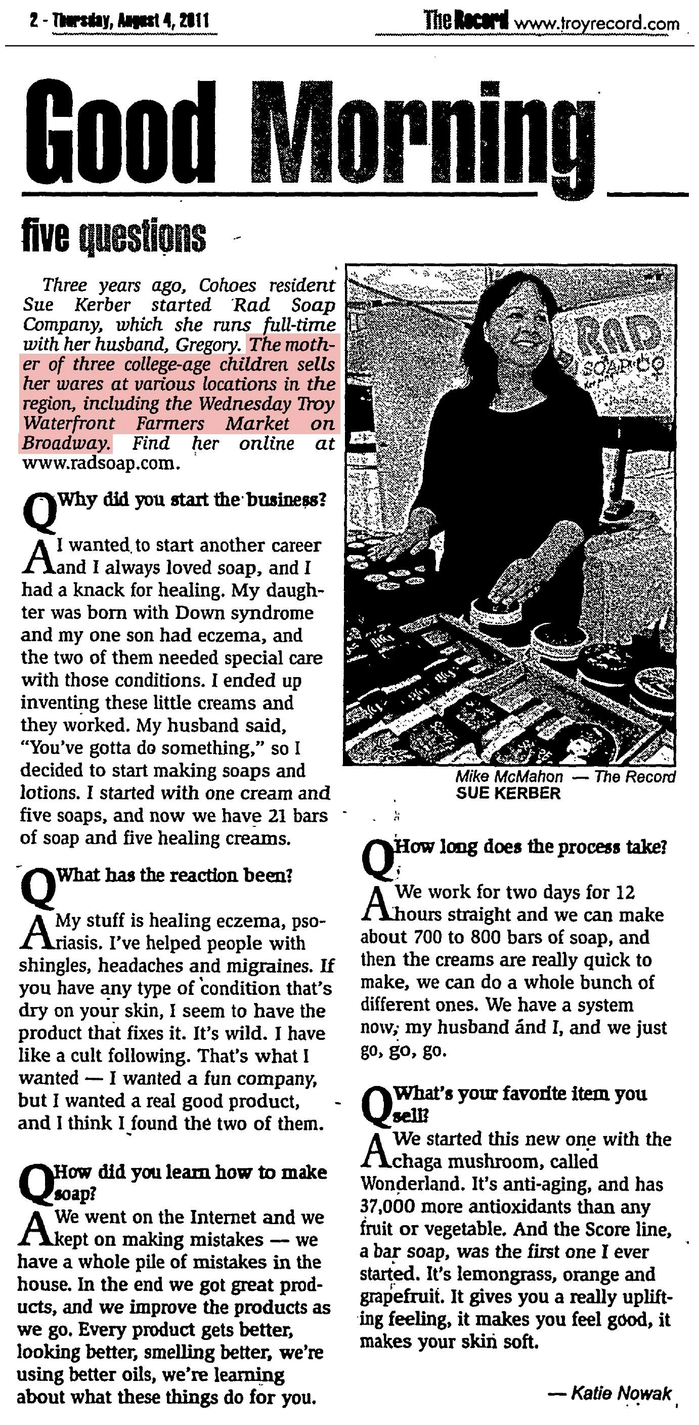 The Record, Thursday, August 4, 2011, page 2: the “Good Morning: five questions” Q&A with Sue Kerber of Rad Soap Company in Cohoes, with a photo of her at her soap display; the Troy Waterfront Farmers Market passage is highlighted.