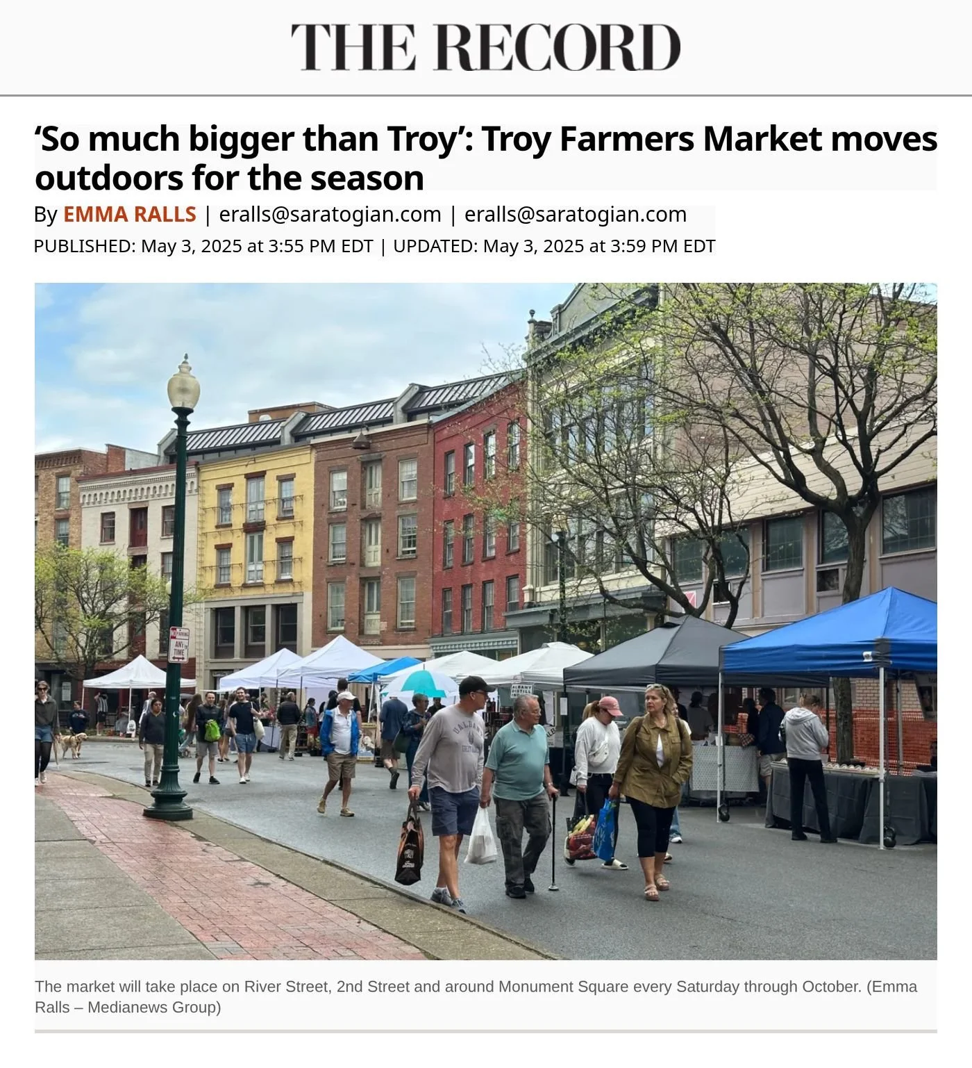 Troy Record website, May 3, 2025: ‘So Much Bigger Than Troy’ by Emma Ralls, with a photo of shoppers and vendor tents along a tree-lined downtown street.