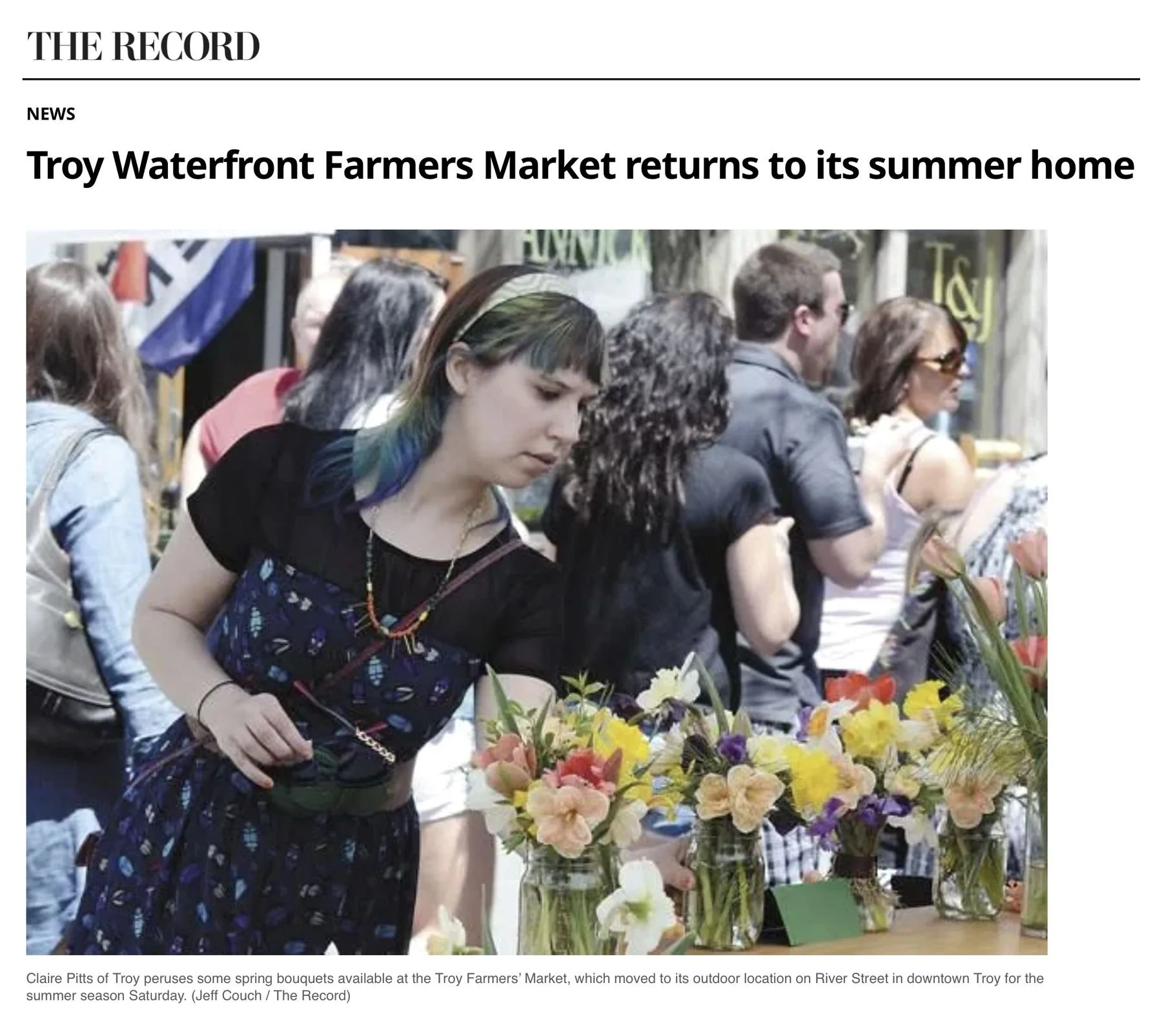 The Record website, Sunday, May 5, 2013: 'Troy Waterfront Farmers Market returns to its summer home,' with Jeff Couch's photo of Claire Pitts of Troy looking at spring bouquets in jars at the market on River Street.