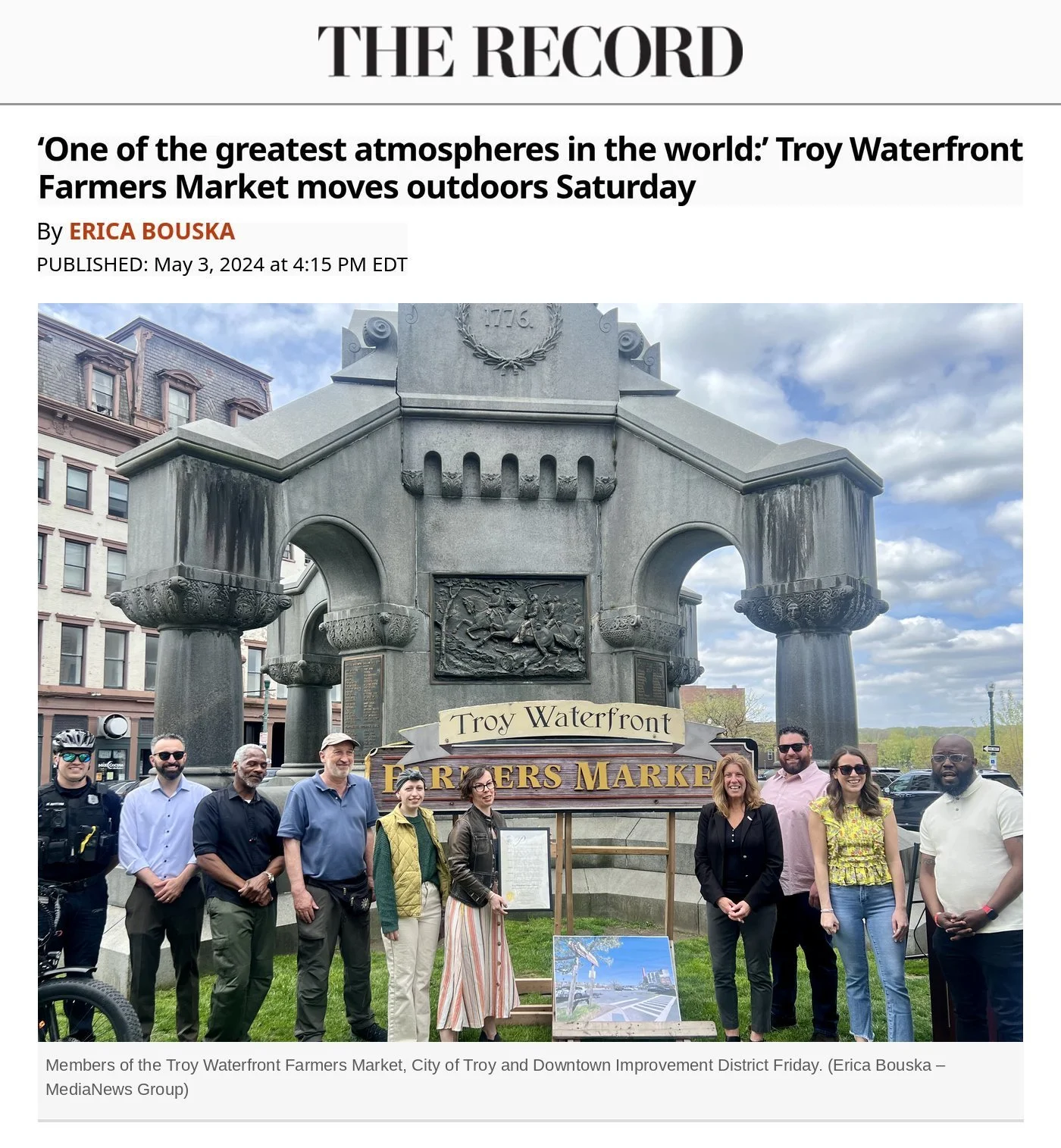The Troy Record's May 3, 2024 story, with a group photo of members of the Troy Waterfront Farmers Market, City of Troy and Downtown Improvement District in Monument Square.