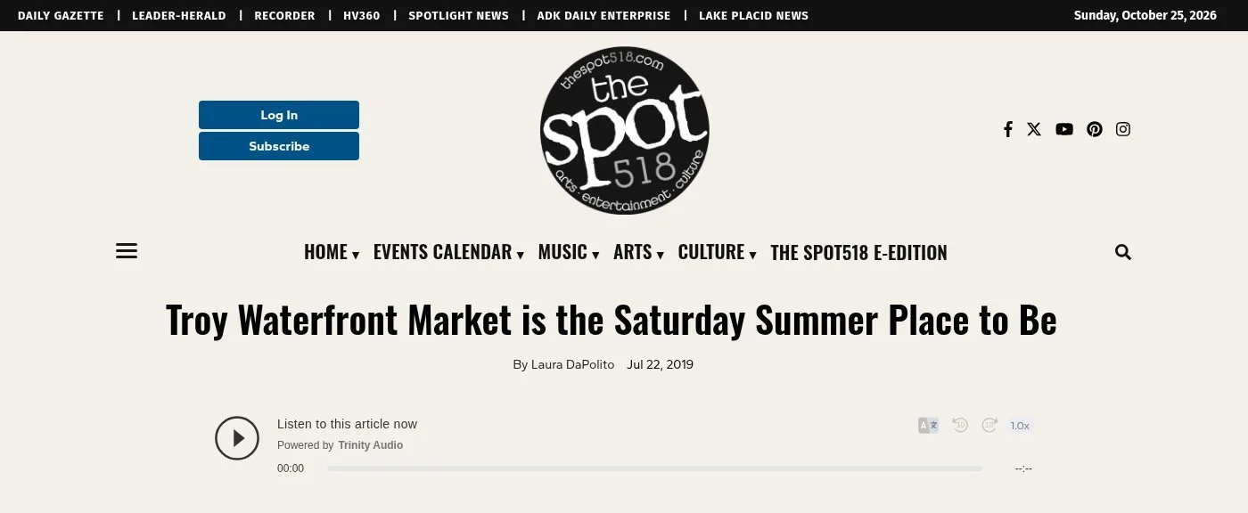 The Spot 518 website, Jul. 22, 2019: 'Troy Waterfront Market is the Saturday Summer Place to Be' by Laura DaPolito, with the headline, byline and an audio player for the article.