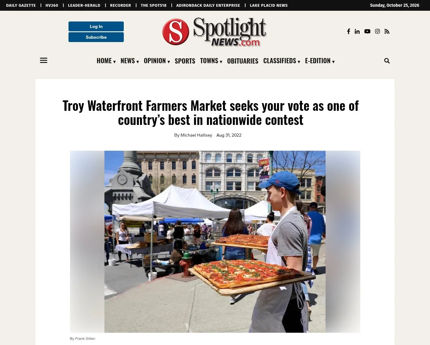 Spotlight News, Aug. 31, 2022: 'Troy Waterfront Farmers Market seeks your vote as one of country’s best in nationwide contest' by Michael Hallisey, with a photo by Frank Gillen of a young man in a blue cap carrying trays of square pizza.