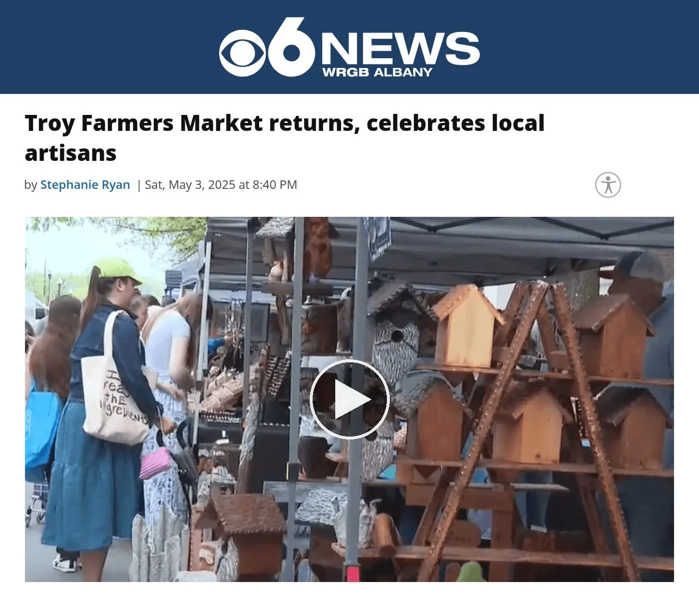 CBS6 Albany website, May 3, 2025: ‘Troy Farmers Market returns, celebrates local artisans’ by Stephanie Ryan, with a video frame of shoppers at a vendor booth with wooden birdhouses.