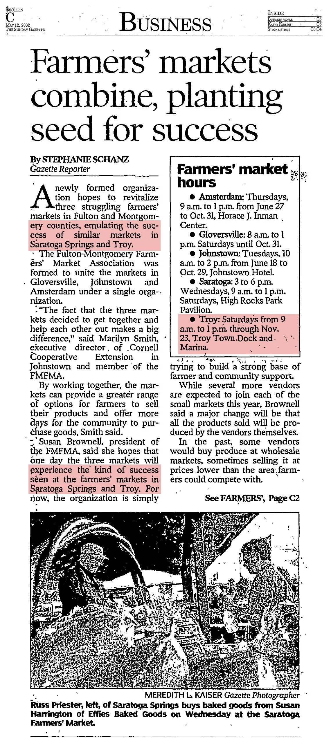 The Sunday Gazette Business front, May 12, 2002, page C1: “Farmers’ markets combine, planting seed for success” by Stephanie Schanz, with a “Farmers’ market hours” box listing the Troy market; the Troy mentions are highlighted.