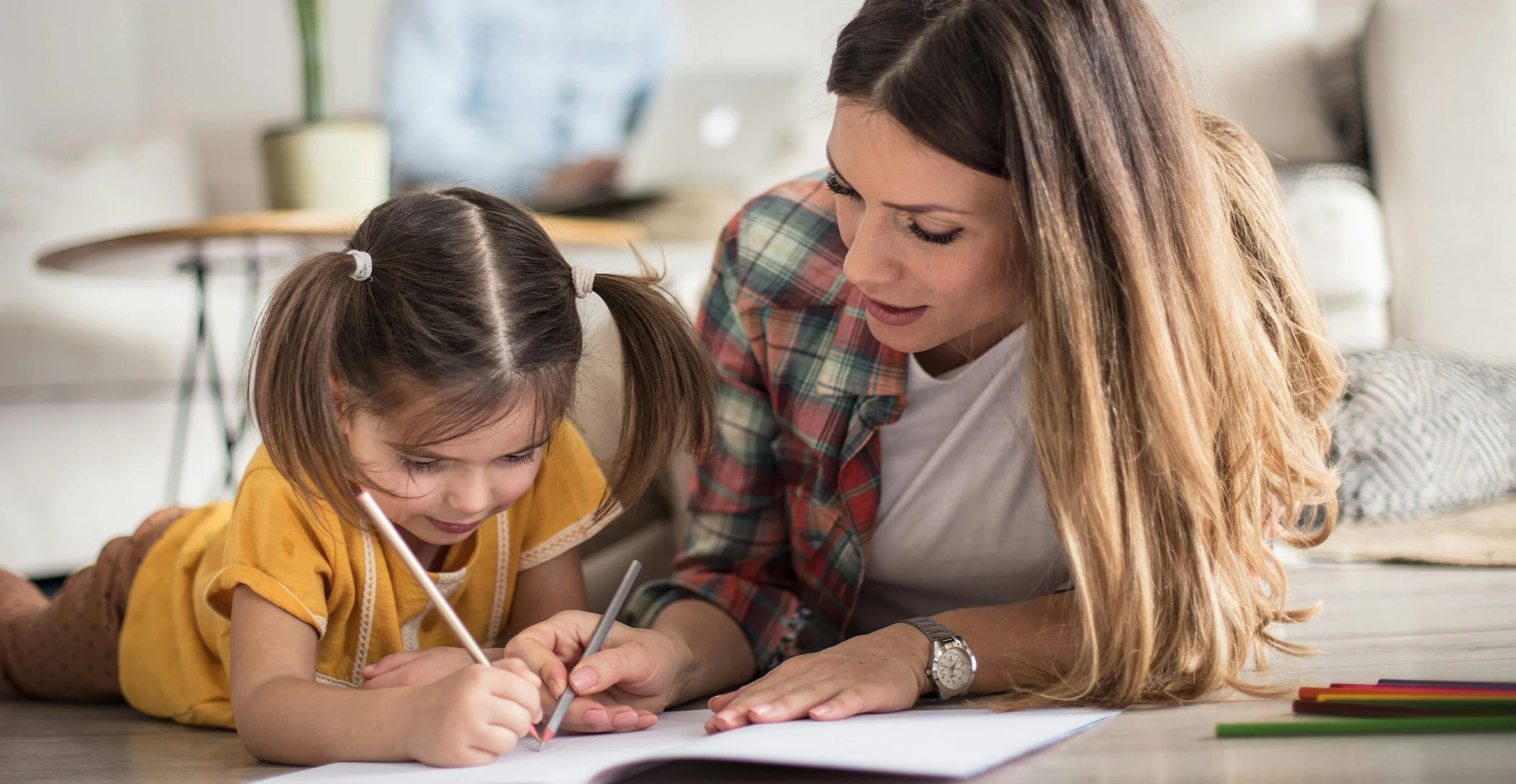 Why Does a Psychoeducational Assessment Cost So Much?, image of mom and child working on school work.