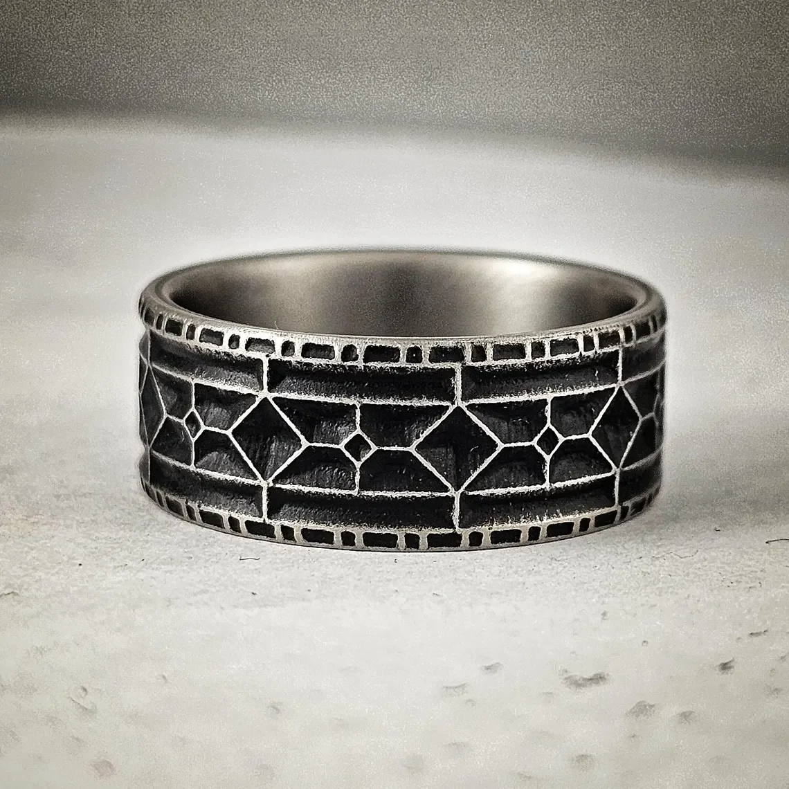 Battleworn Titanium Viking Wedding Ring - 9mm Rampart Design (4).webp