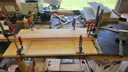 Shutter clamped on the workbench in the workshop.