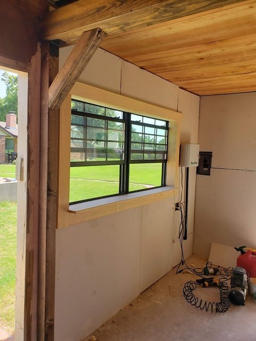 Large window and wooden ceiling.
