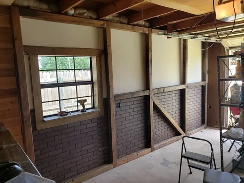 Window framed in wood during construction.
