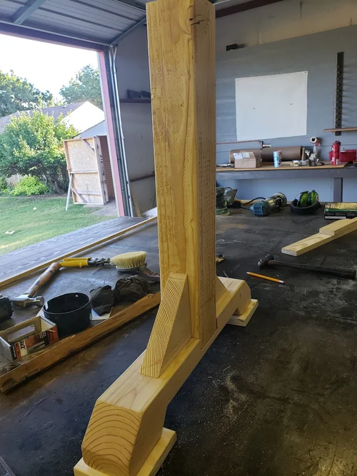 Custom wooden piece being built on the workbench.