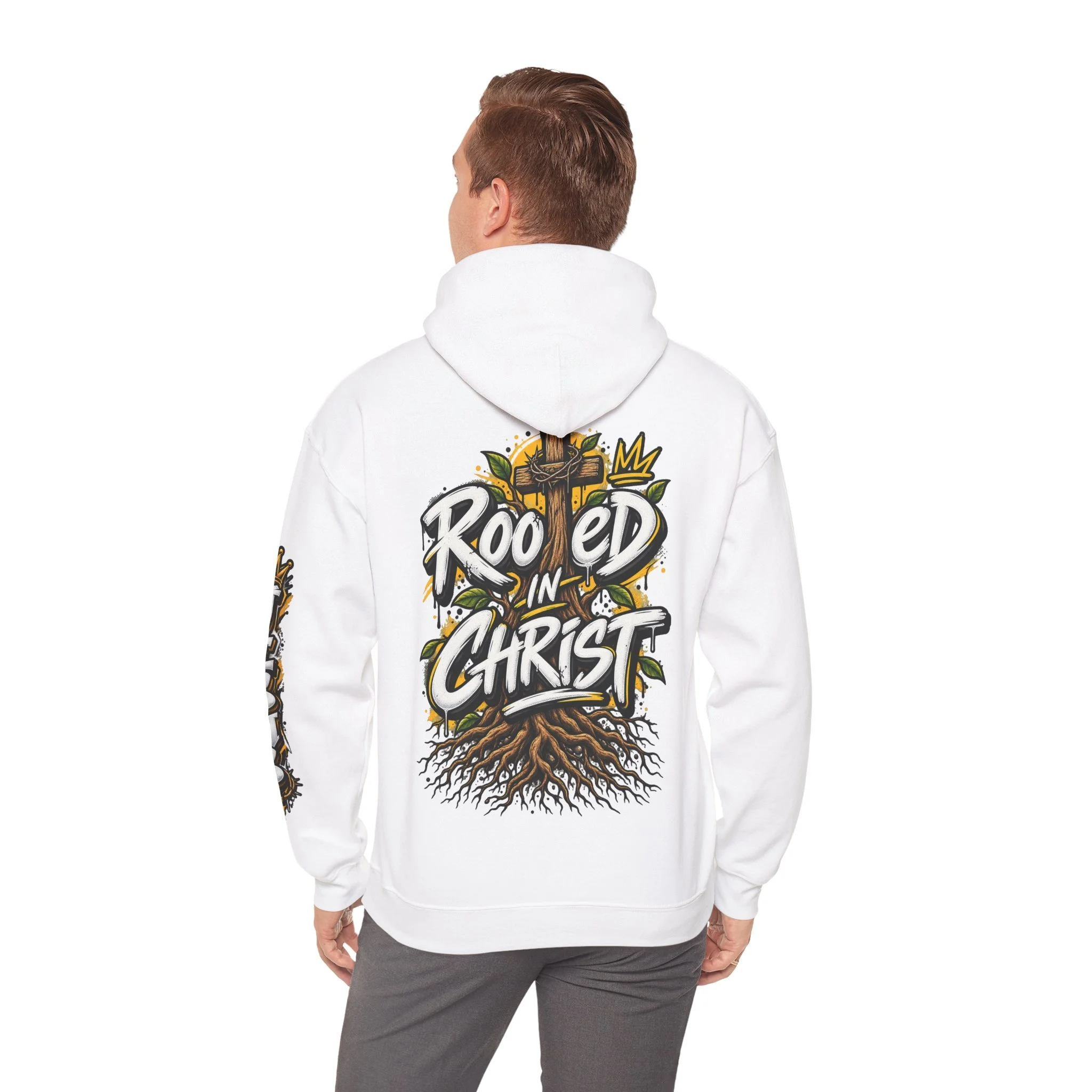 Unisex black hoodie featuring a vibrant graffiti-style 'Rooted in Christ' design with a cross, tree roots, and a crown.