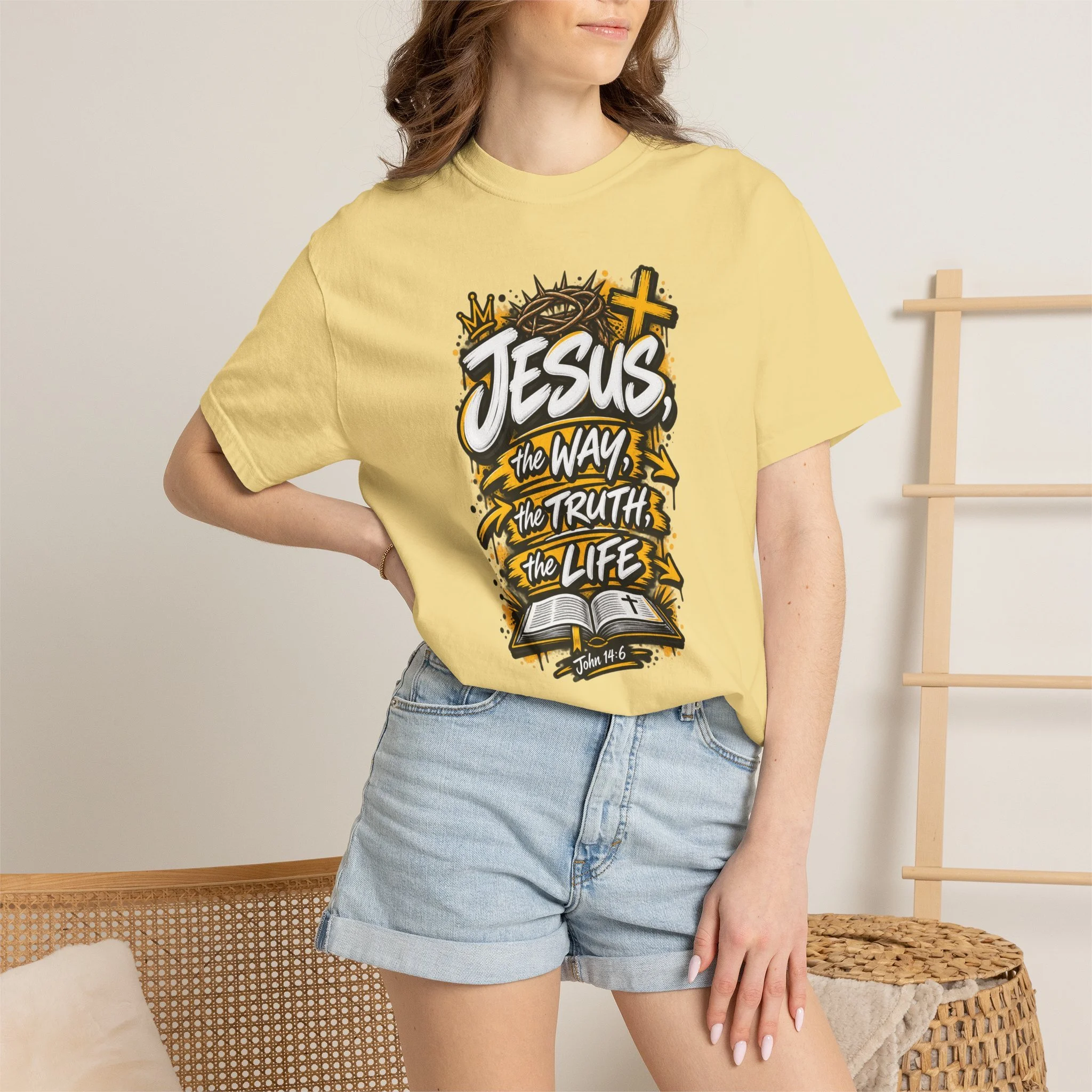 Unisex t-shirt with bold yellow and white graffiti art featuring a crown of thorns, a cross, an open Bible, and the text 'Jesus, The Way, The Truth, The Life'
