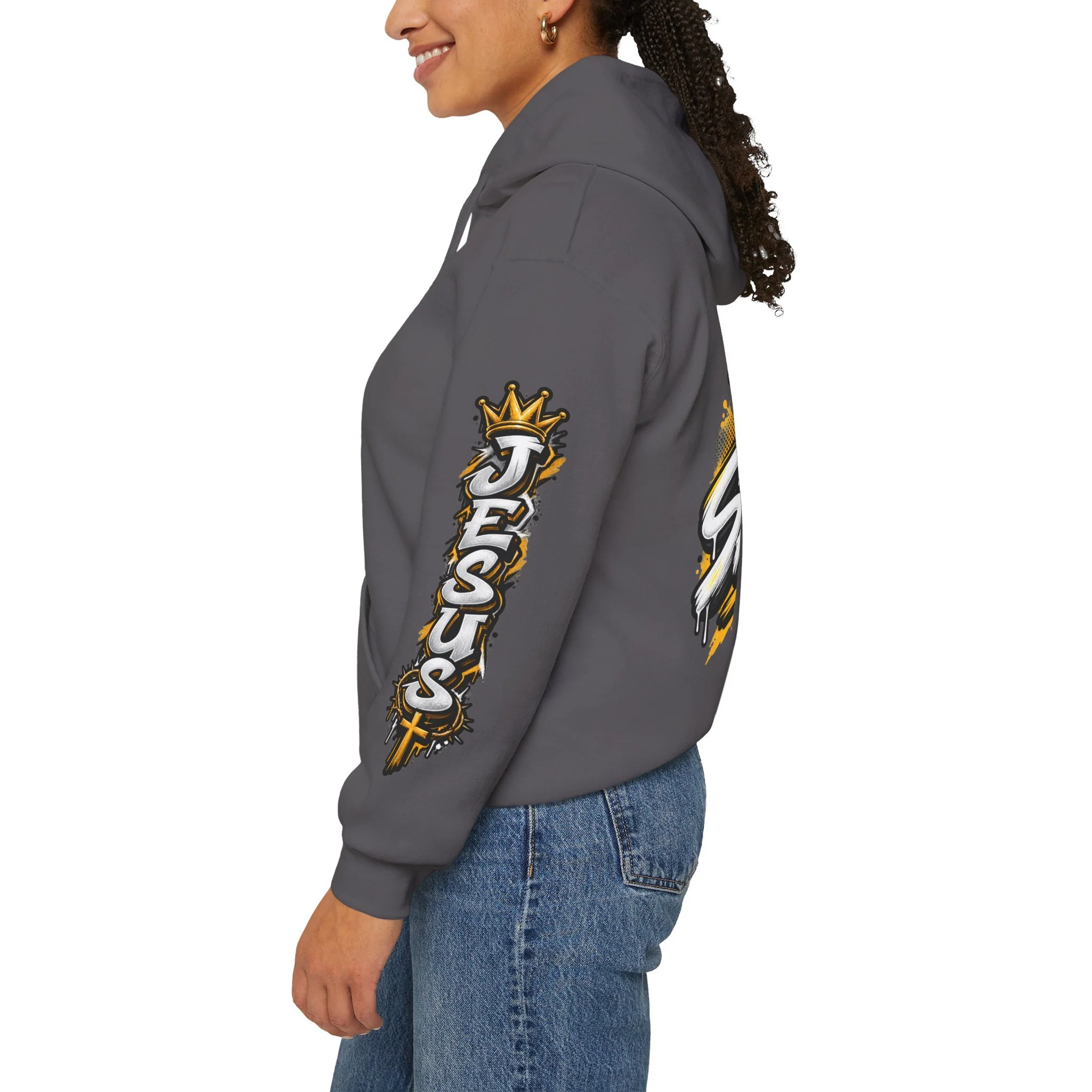 Charcoal Unisex streetwear hoodie featuring bold graffiti-style 'SAVED' lettering, a crown, a cross, halftone patterns, and 'Rom 10:9'.