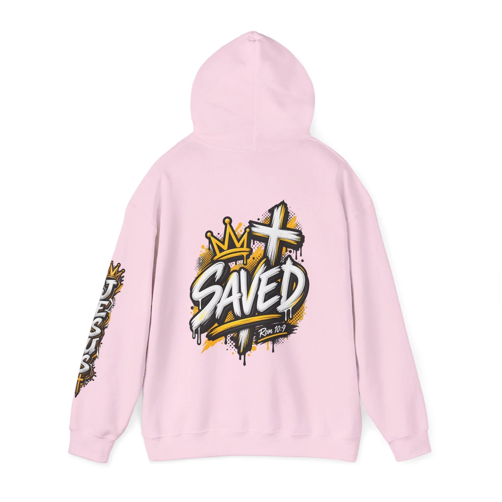 Light pink Unisex streetwear hoodie featuring bold graffiti-style 'SAVED' lettering, a crown, a cross, halftone patterns, and 'Rom 10:9'.
