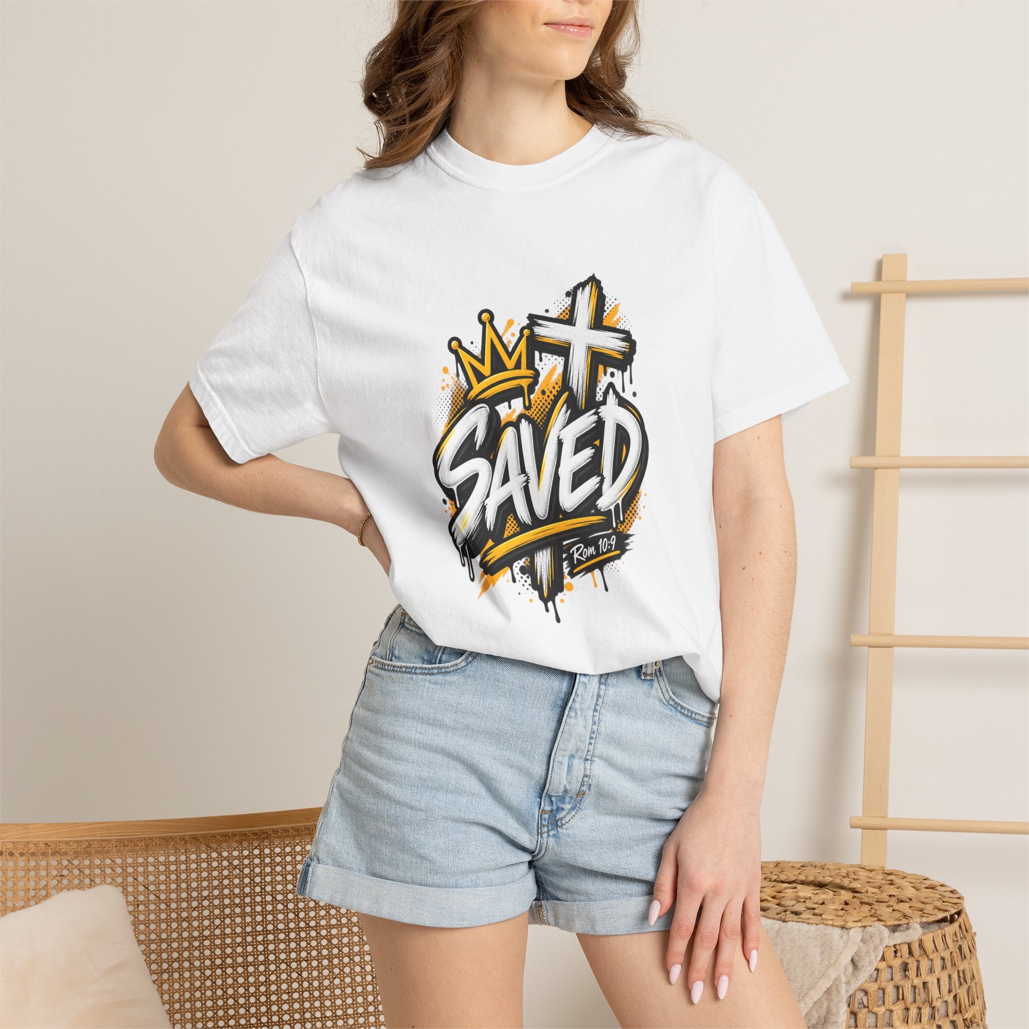 White Unisex black and yellow streetwear t-shirt featuring bold graffiti lettering that reads 'SAVED', a crown, a cross, and 'Rom 10:9'.