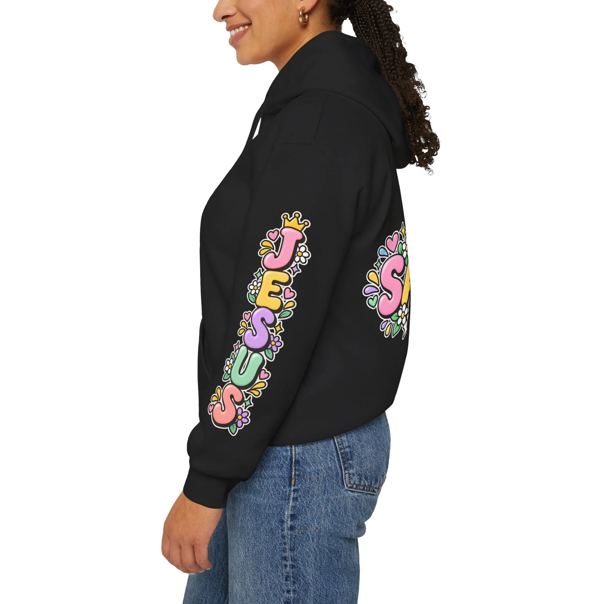Black Unisex pastel hoodie featuring cute 3D bubble letters spelling SAVED with flowers, hearts, a wooden cross, and a banner reading ROM 10:9.