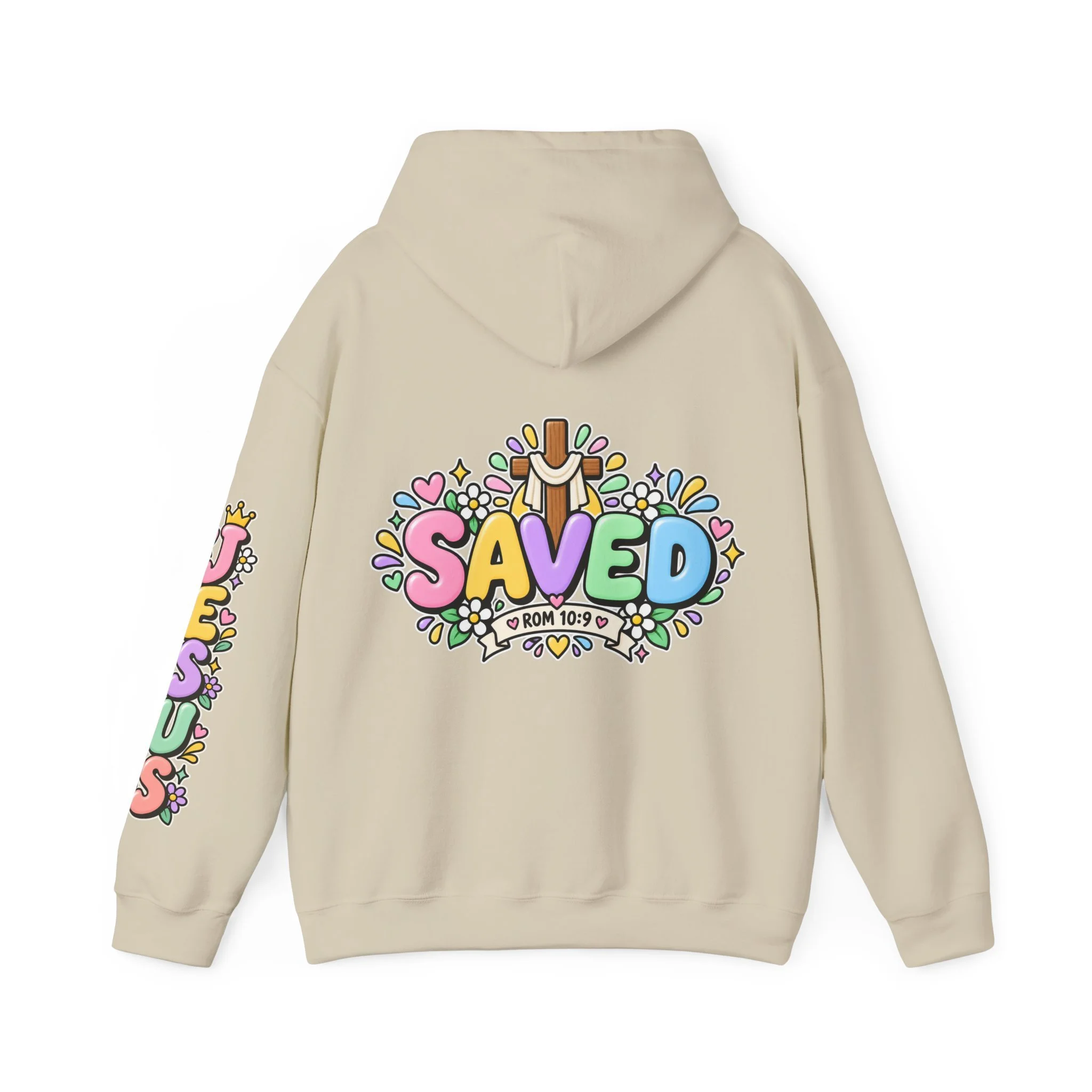 Sand Unisex pastel hoodie featuring cute 3D bubble letters spelling SAVED with flowers, hearts, a wooden cross, and a banner reading ROM 10:9.