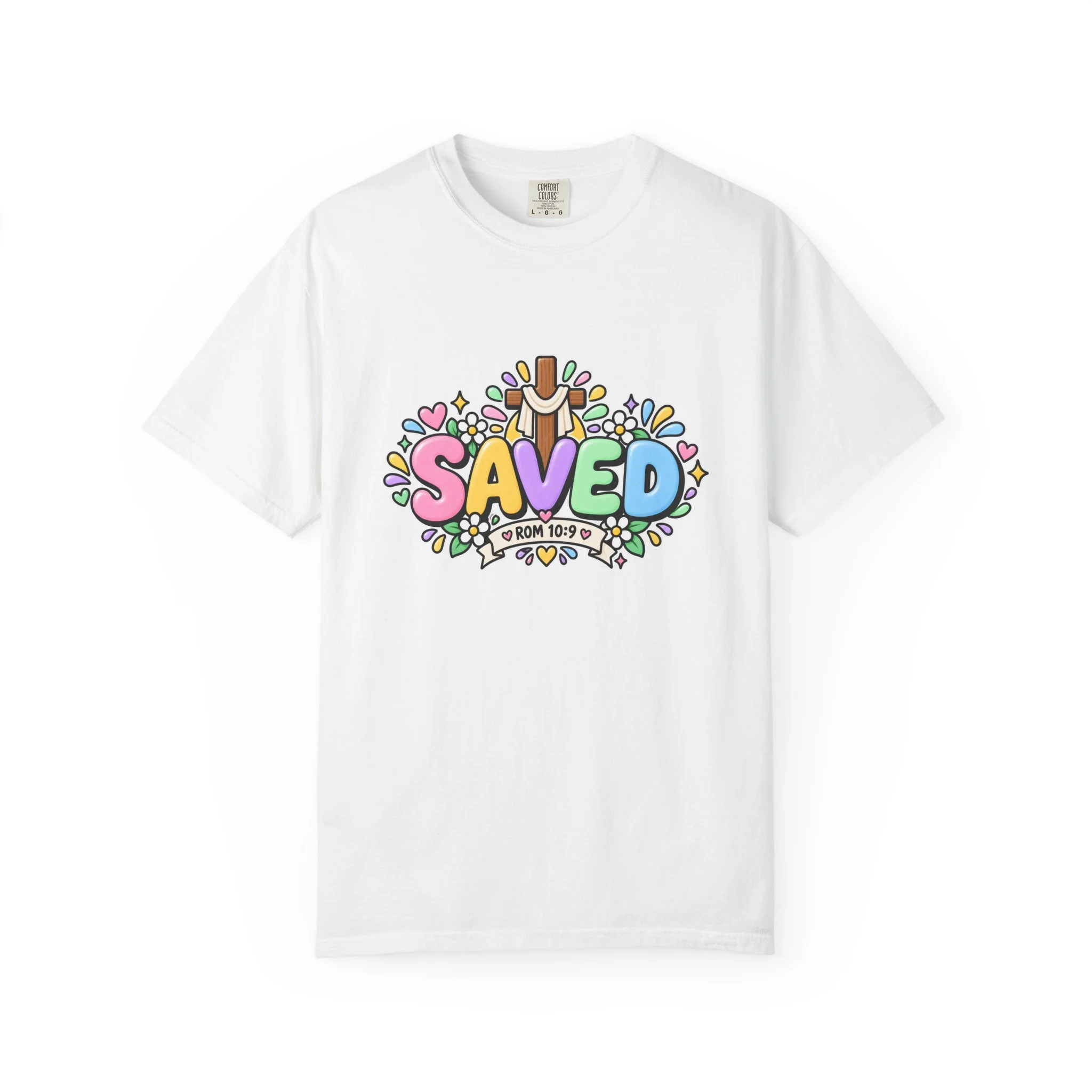 White pastel hoodie featuring cute 3D bubble letters spelling SAVED with flowers, hearts, a wooden cross, and a banner reading ROM 10:9.
