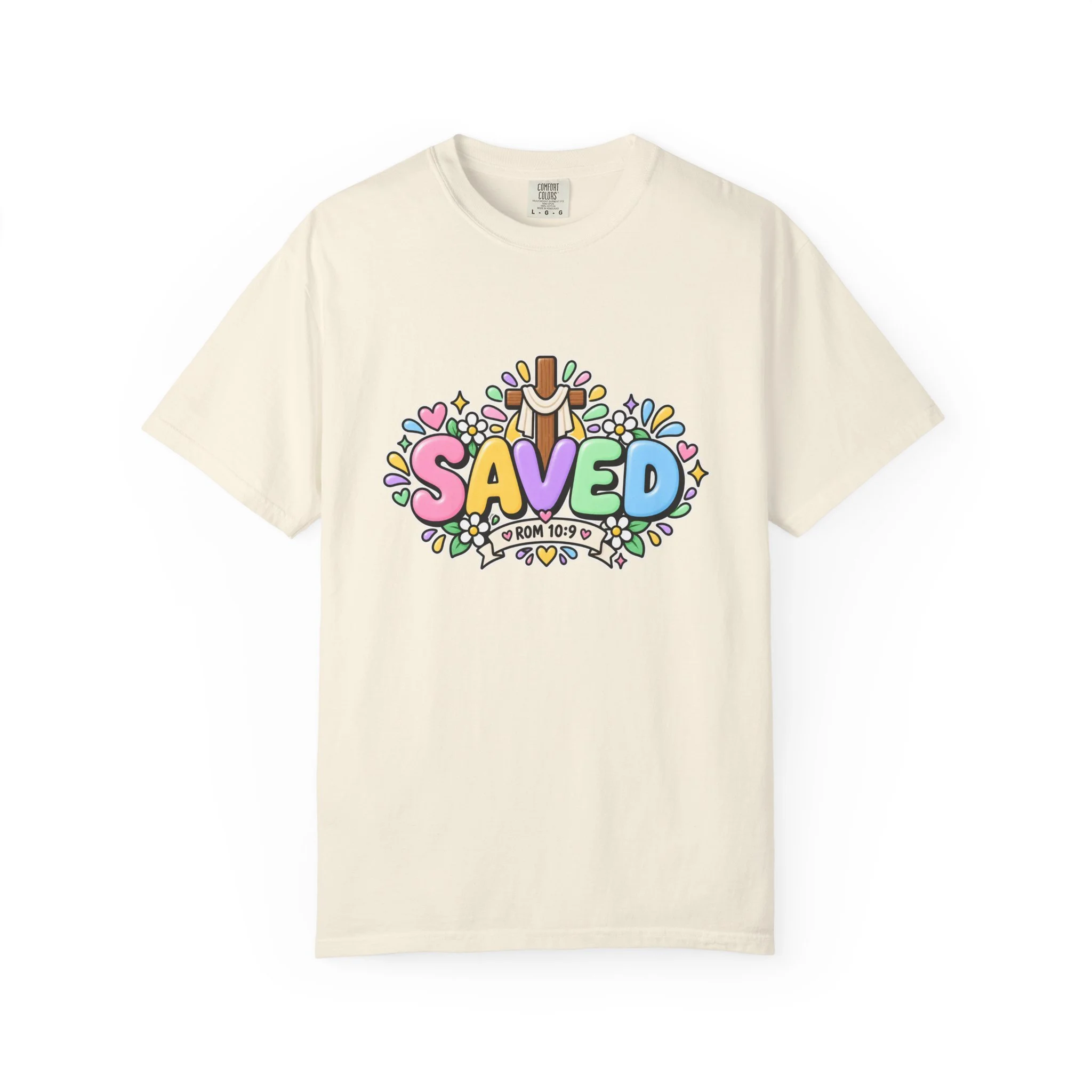 Sand pastel hoodie featuring cute 3D bubble letters spelling SAVED with flowers, hearts, a wooden cross, and a banner reading ROM 10:9.