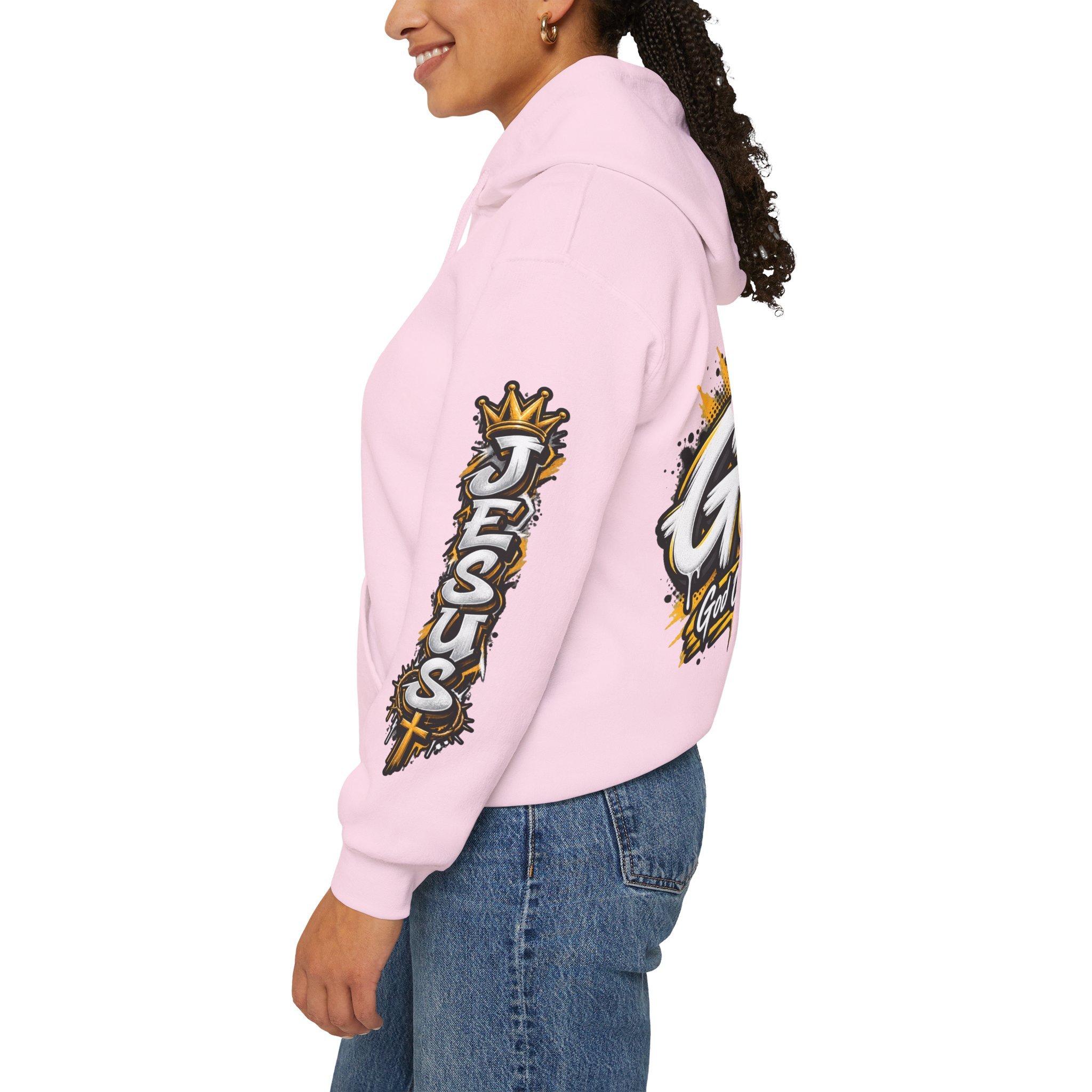 pink unisex streetwear hoodie featuring yellow and white graffiti lettering spelling GOAT, a crown, a cross, and 'God Over All Things'.