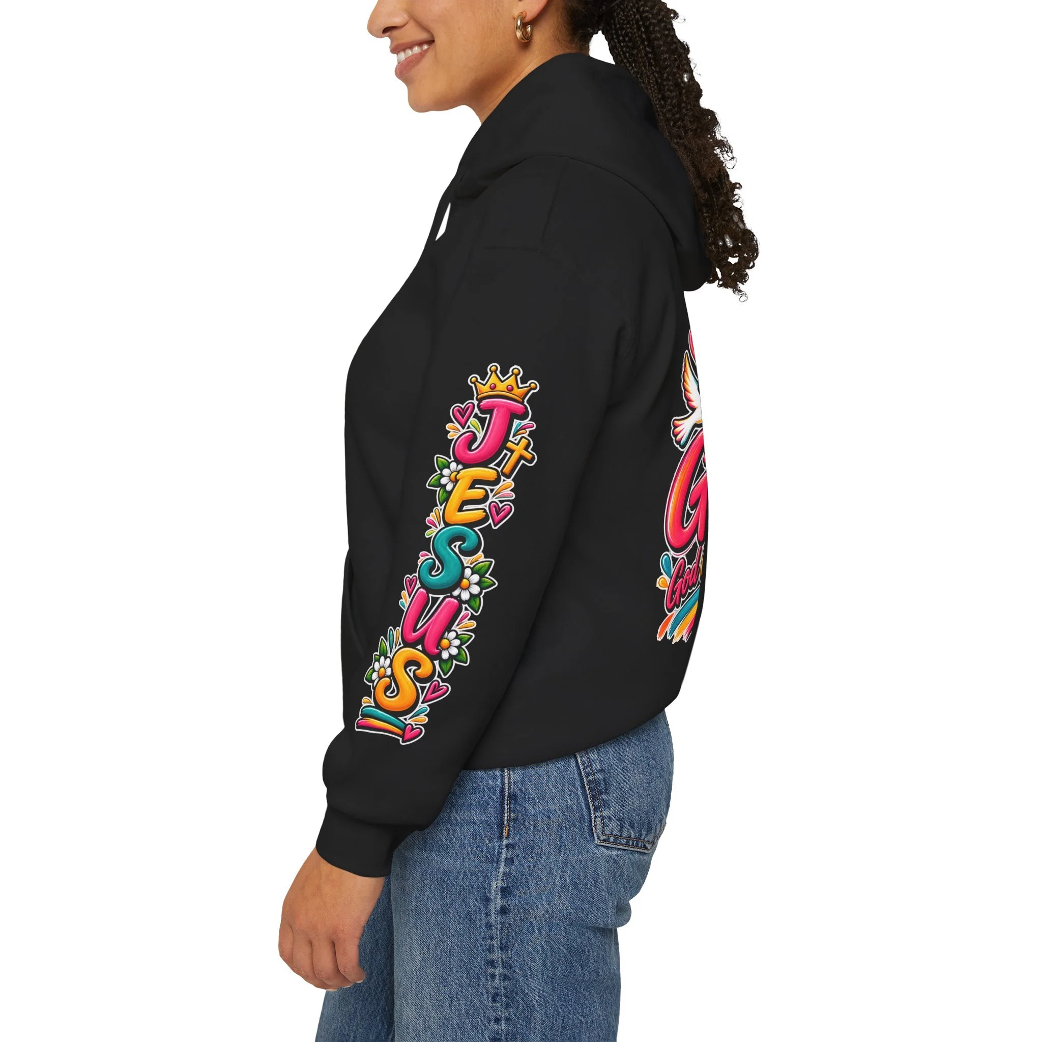 Black unisex hoodie featuring colorful, vivid modern lettering spelling GOAT with a cross, a crown, hearts, a dove, and a banner reading "God Over All Things".
