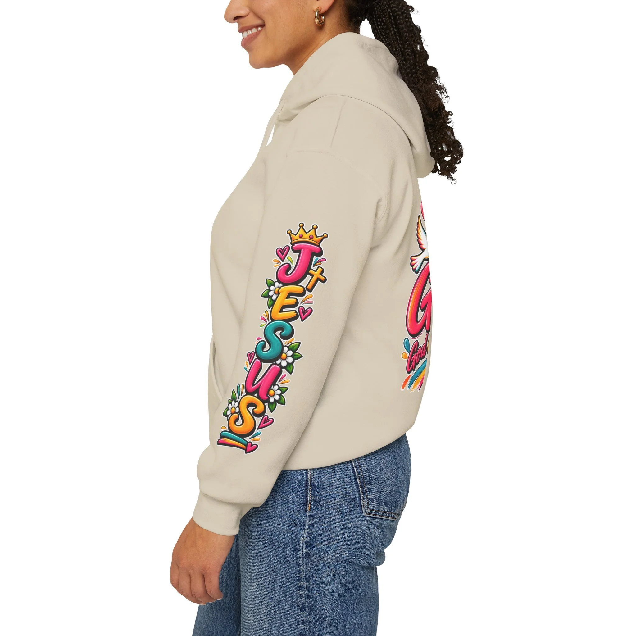 Sand unisex hoodie featuring colorful, vivid modern lettering spelling GOAT with a cross, a crown, hearts, a dove, and a banner reading "God Over All Things".