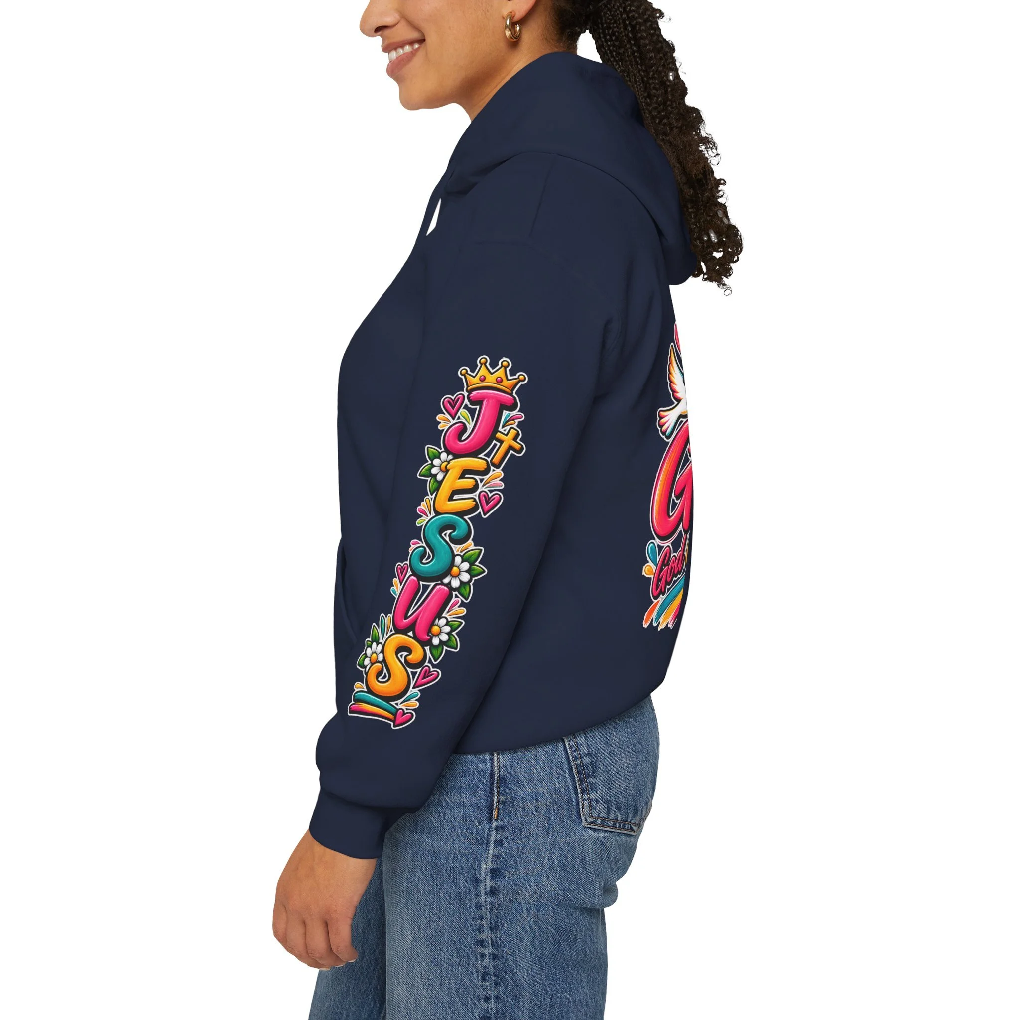 Navy blue unisex hoodie featuring colorful, vivid modern lettering spelling GOAT with a cross, a crown, hearts, a dove, and a banner reading "God Over All Things".