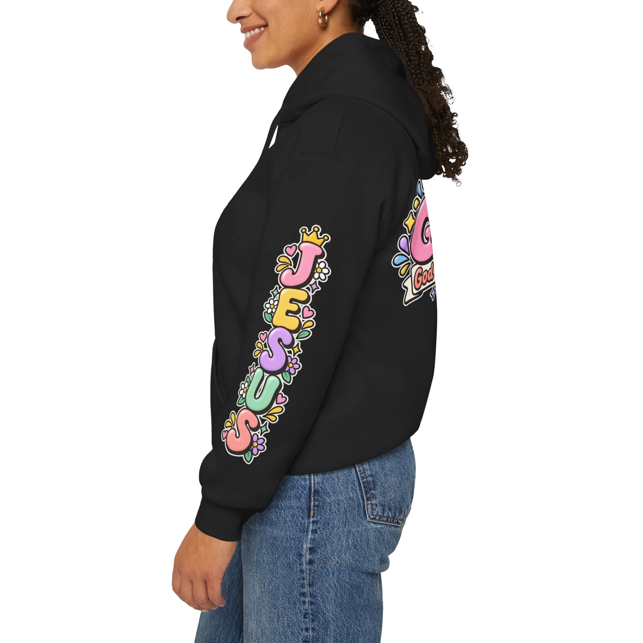 Black unisex hoodie featuring cute 3D pastel bubble letters spelling GOAT with a crown, a cross integrated into the letter T, hearts, sparkles, and a banner reading "God Over All Things".