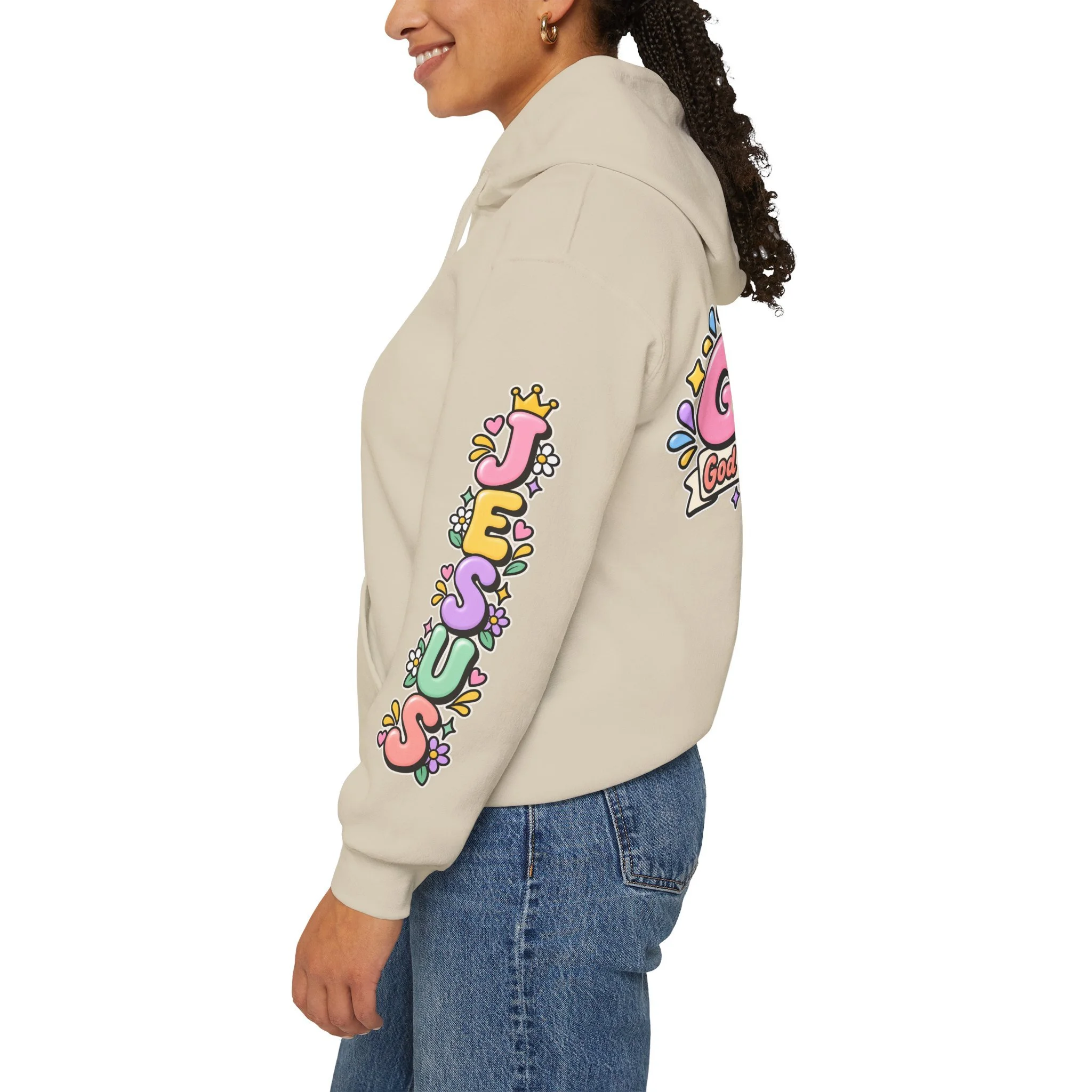 Sand unisex hoodie featuring cute 3D pastel bubble letters spelling GOAT with a crown, a cross integrated into the letter T, hearts, sparkles, and a banner reading "God Over All Things".