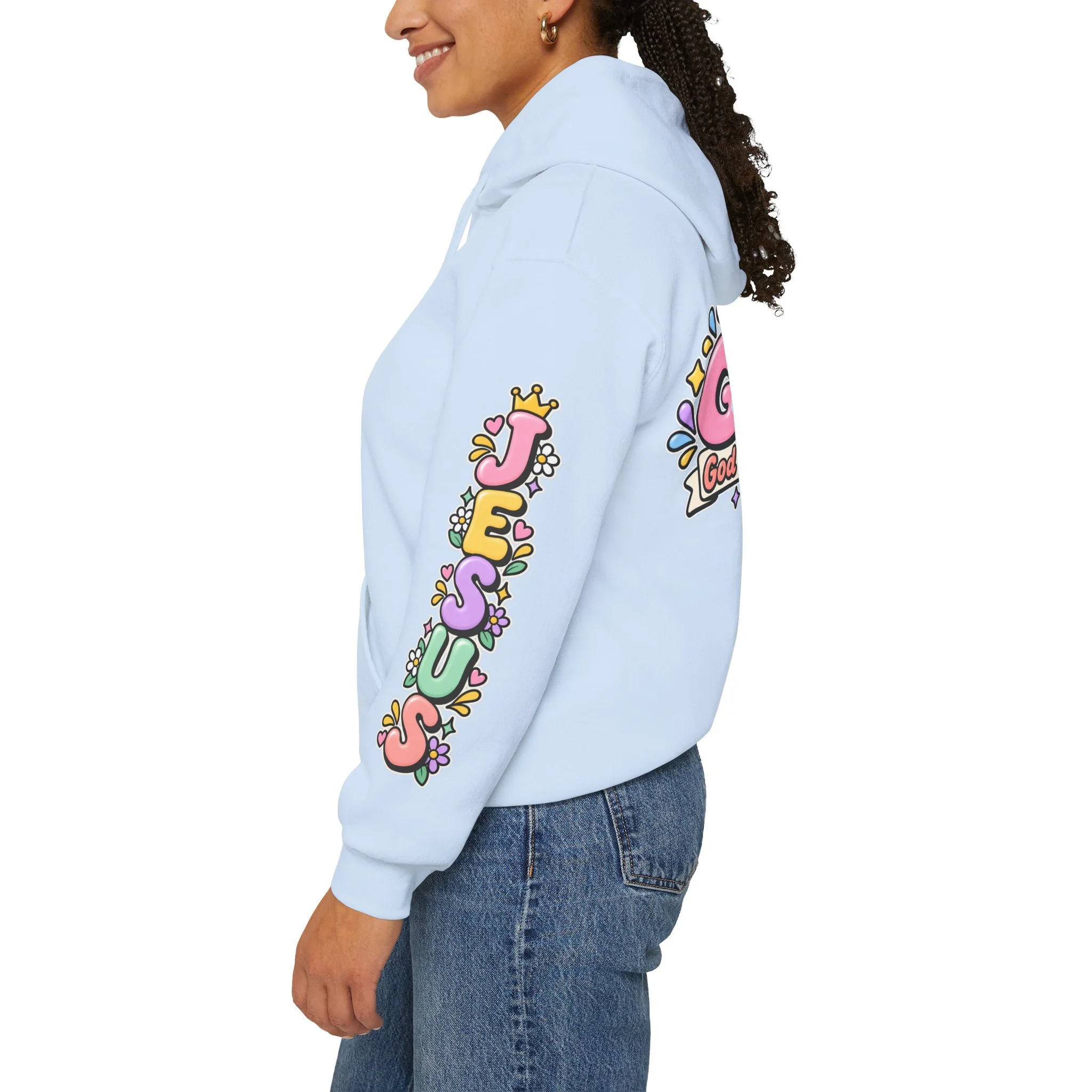 Light blue unisex hoodie featuring cute 3D pastel bubble letters spelling GOAT with a crown, a cross integrated into the letter T, hearts, sparkles, and a banner reading "God Over All Things".