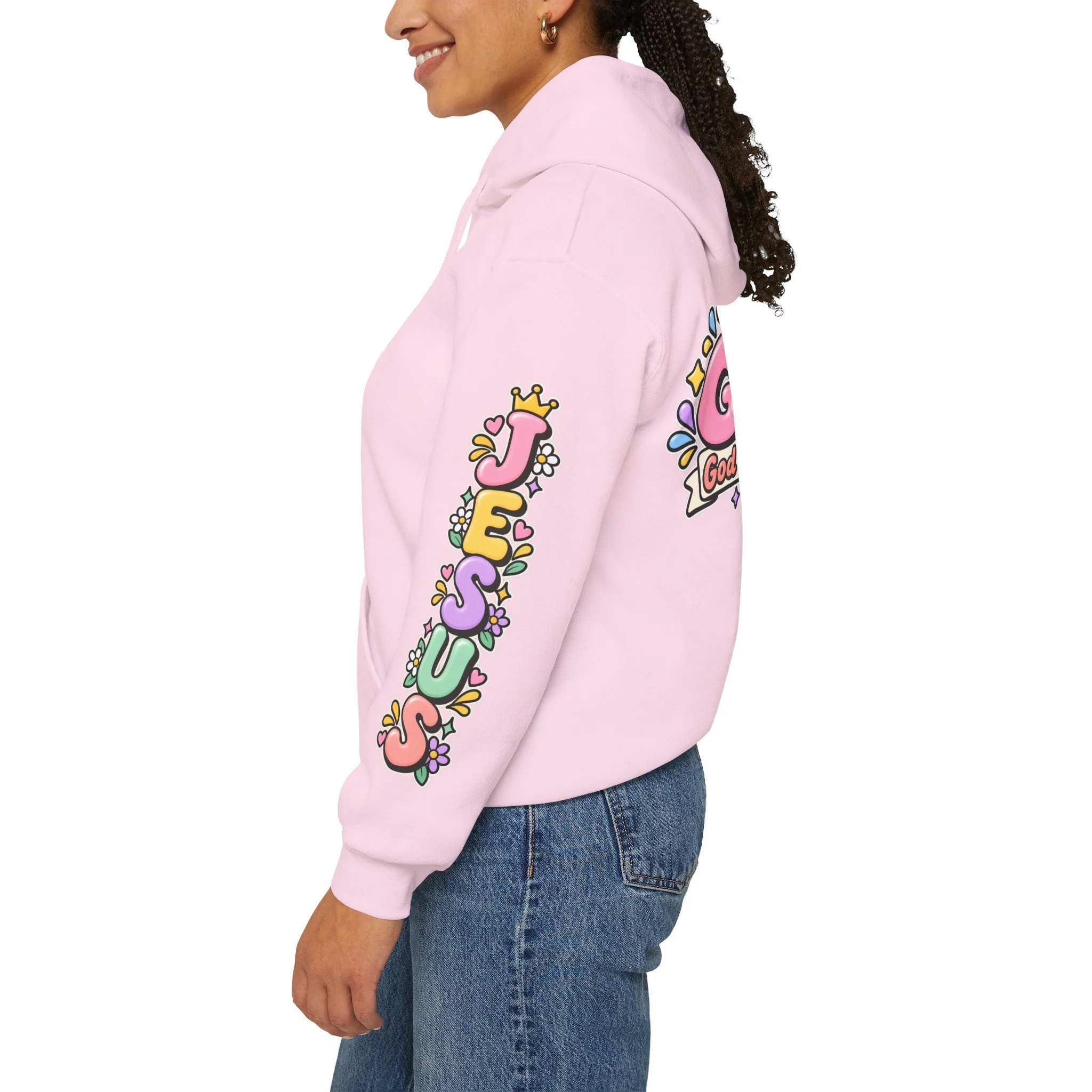 Light pink unisex hoodie featuring cute 3D pastel bubble letters spelling GOAT with a crown, a cross integrated into the letter T, hearts, sparkles, and a banner reading "God Over All Things".