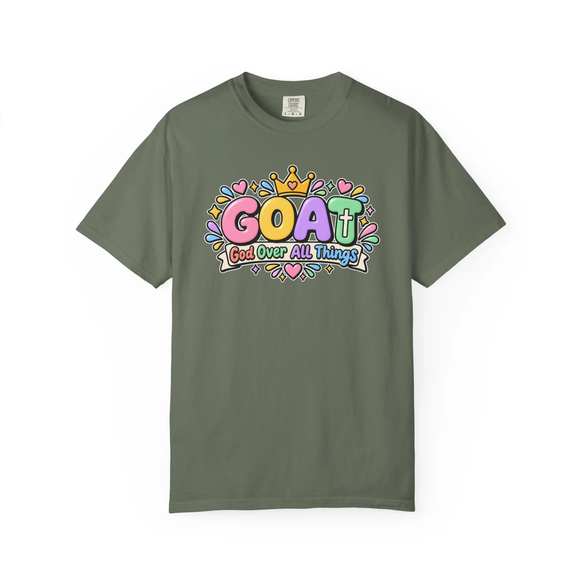 Military green unisex t-shirt graphic showing cute 3D pastel bubble letters spelling GOAT, a yellow crown with a heart, hearts, sparkles, and a banner below that reads "God Over All Things".