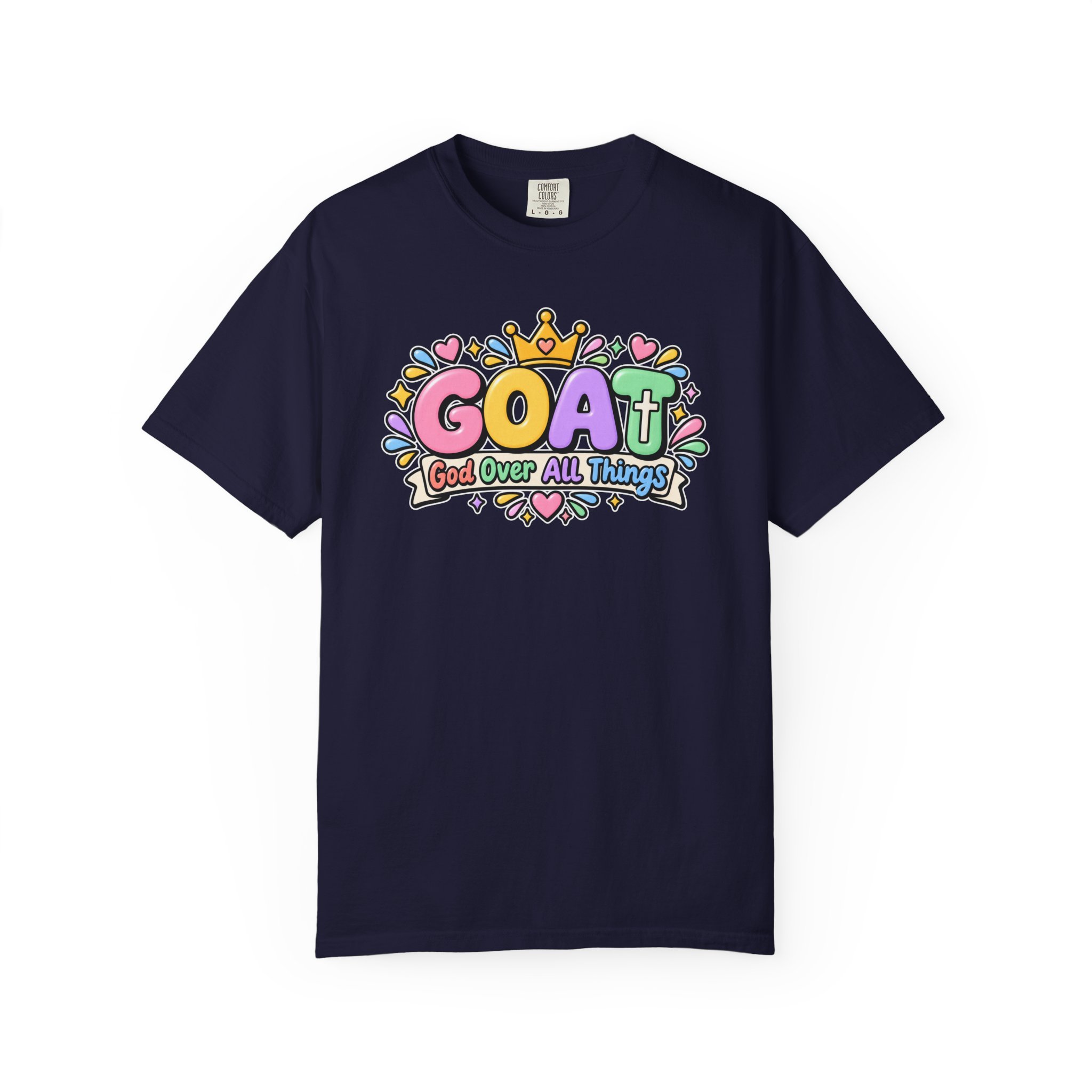 Navy blue unisex t-shirt graphic showing cute 3D pastel bubble letters spelling GOAT, a yellow crown with a heart, hearts, sparkles, and a banner below that reads "God Over All Things".