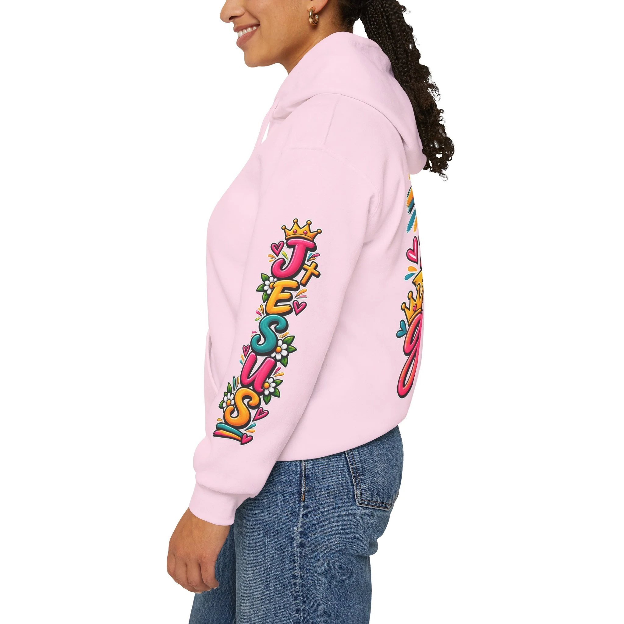 Light pink unisex hoodie featuring vibrant, colorful modern script that reads "All for His Glory", accented with a painted cross, a crown, a dove carrying an olive branch, and hearts.