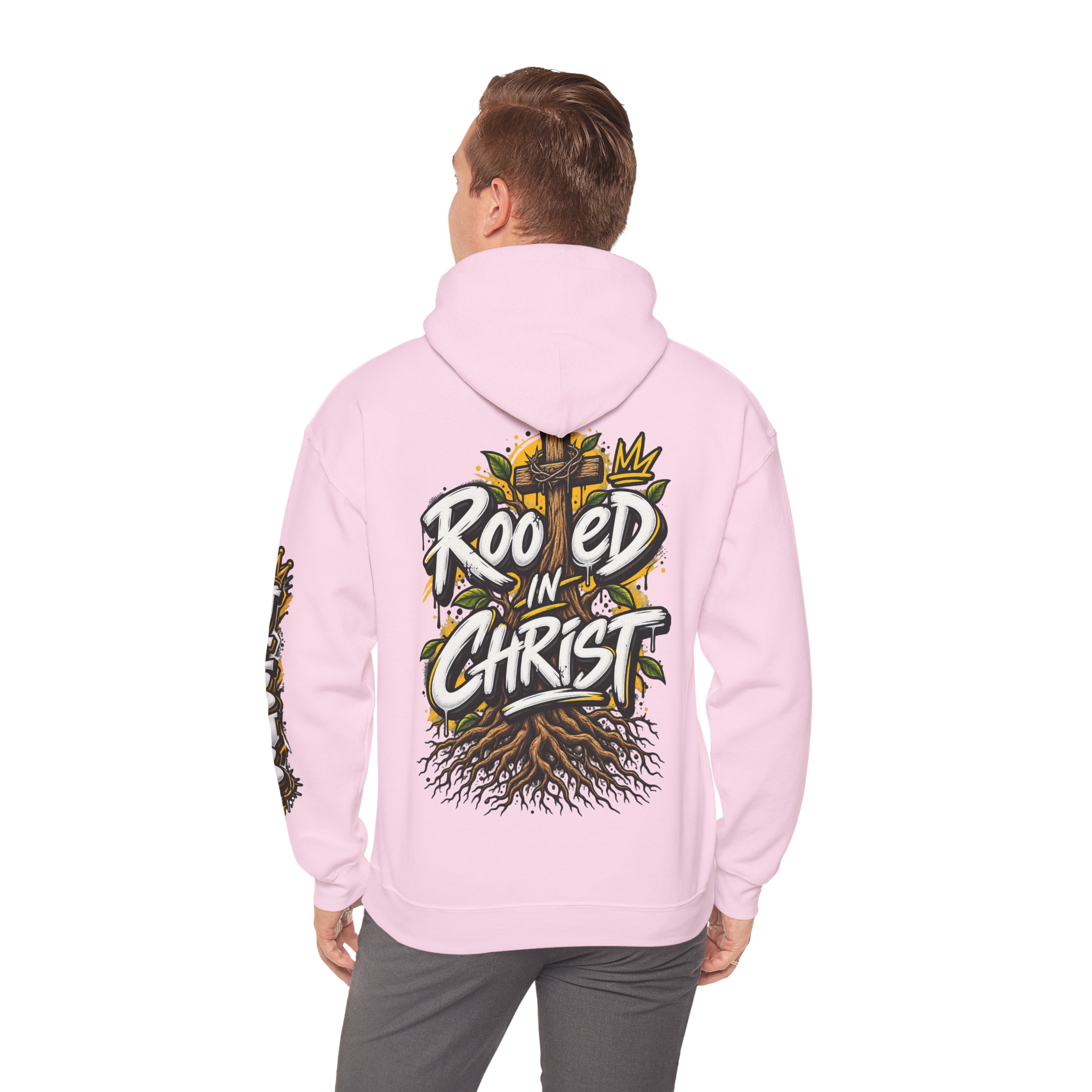 Unisex black hoodie featuring a vibrant graffiti-style 'Rooted in Christ' design with a cross, tree roots, and a crown.