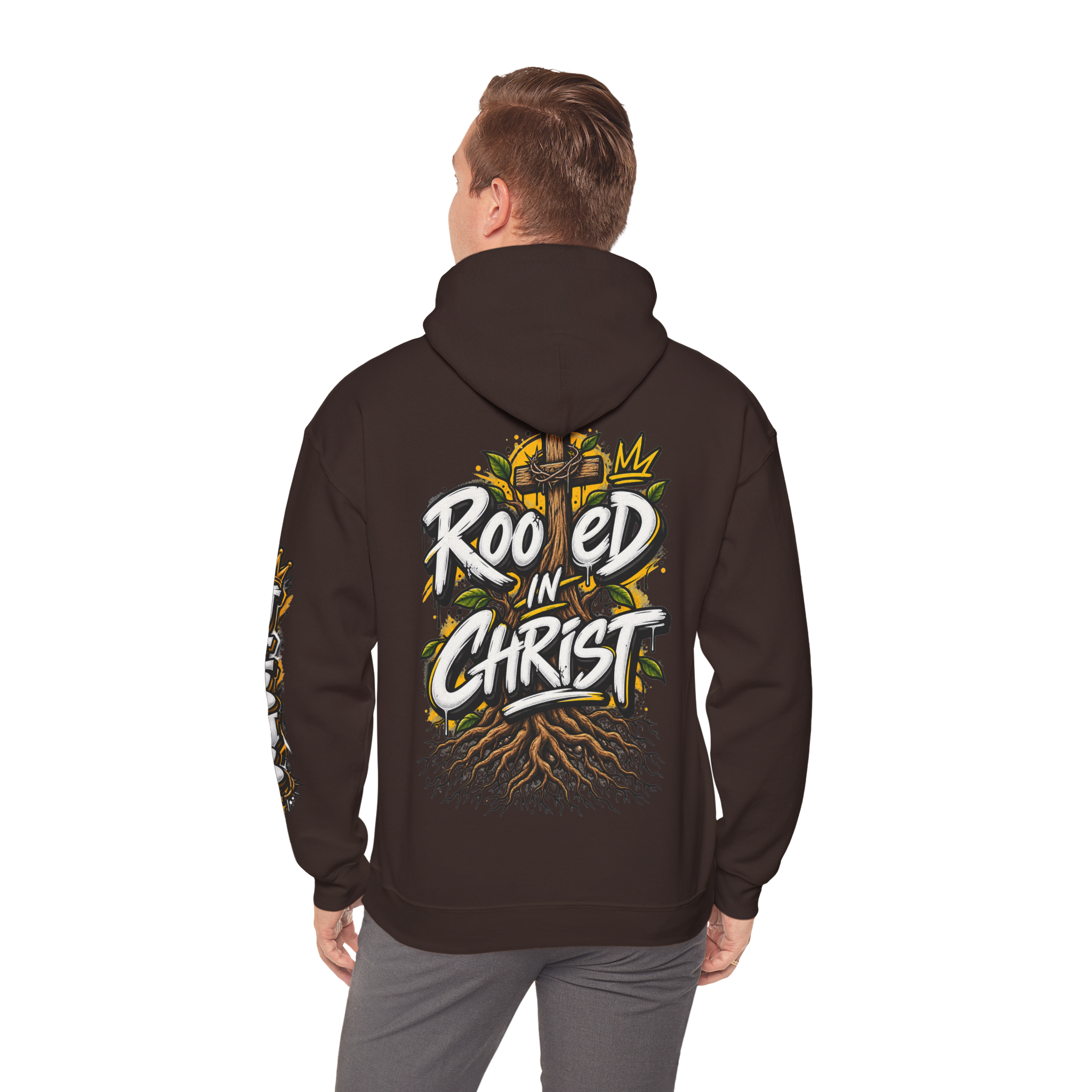 Unisex black hoodie featuring a vibrant graffiti-style 'Rooted in Christ' design with a cross, tree roots, and a crown.