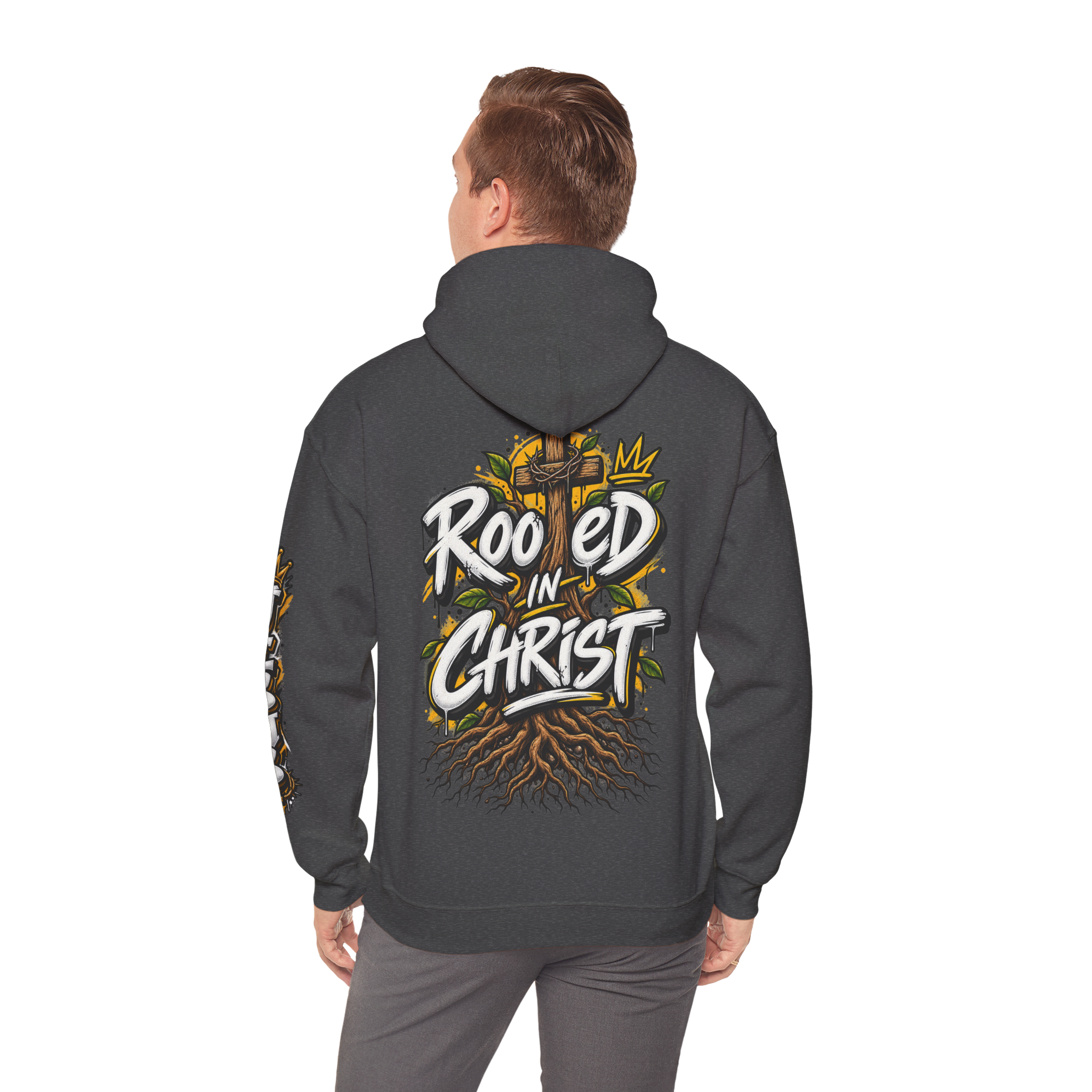Unisex black hoodie featuring a vibrant graffiti-style 'Rooted in Christ' design with a cross, tree roots, and a crown.