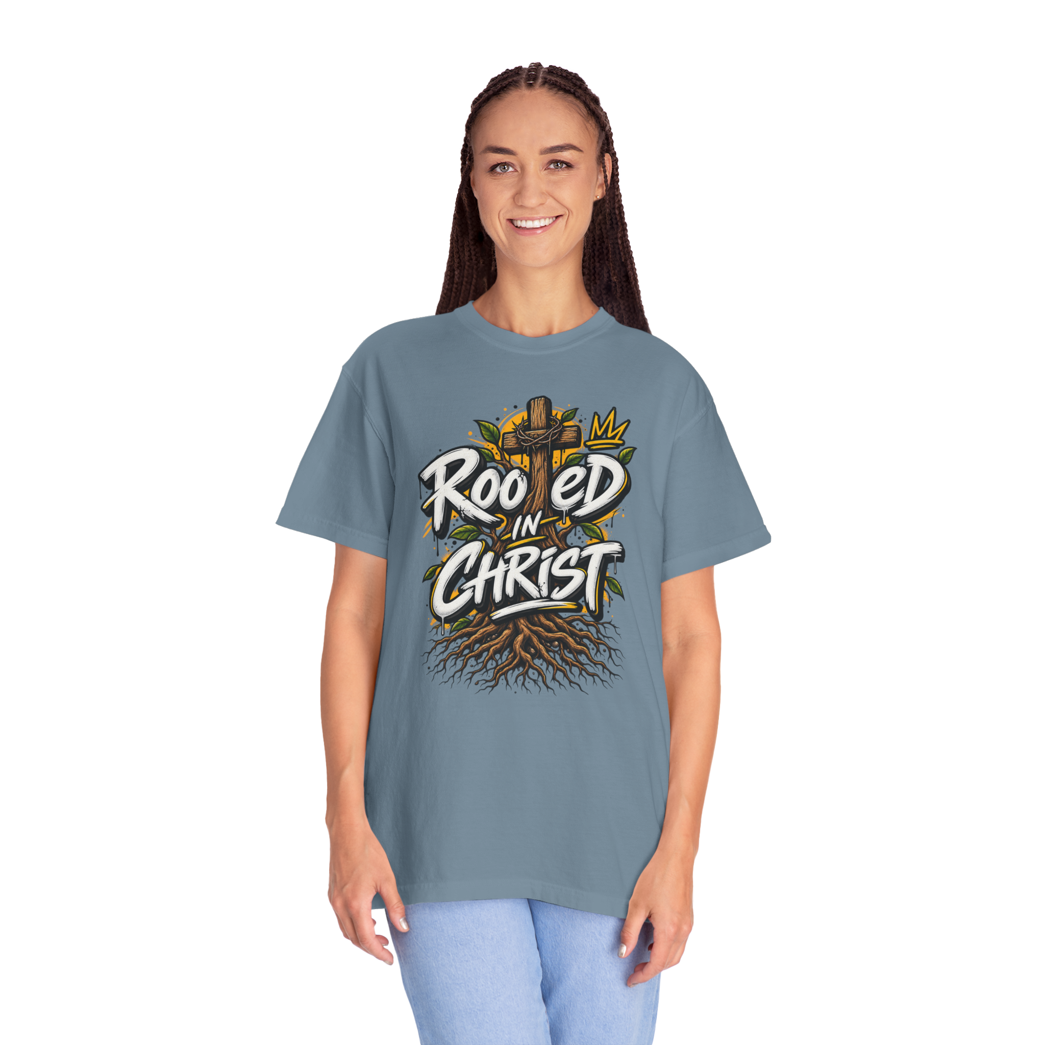 Unisex blue t-shirt featuring a vibrant graffiti-style 'Rooted in Christ' design with a cross, tree roots, and a crown.