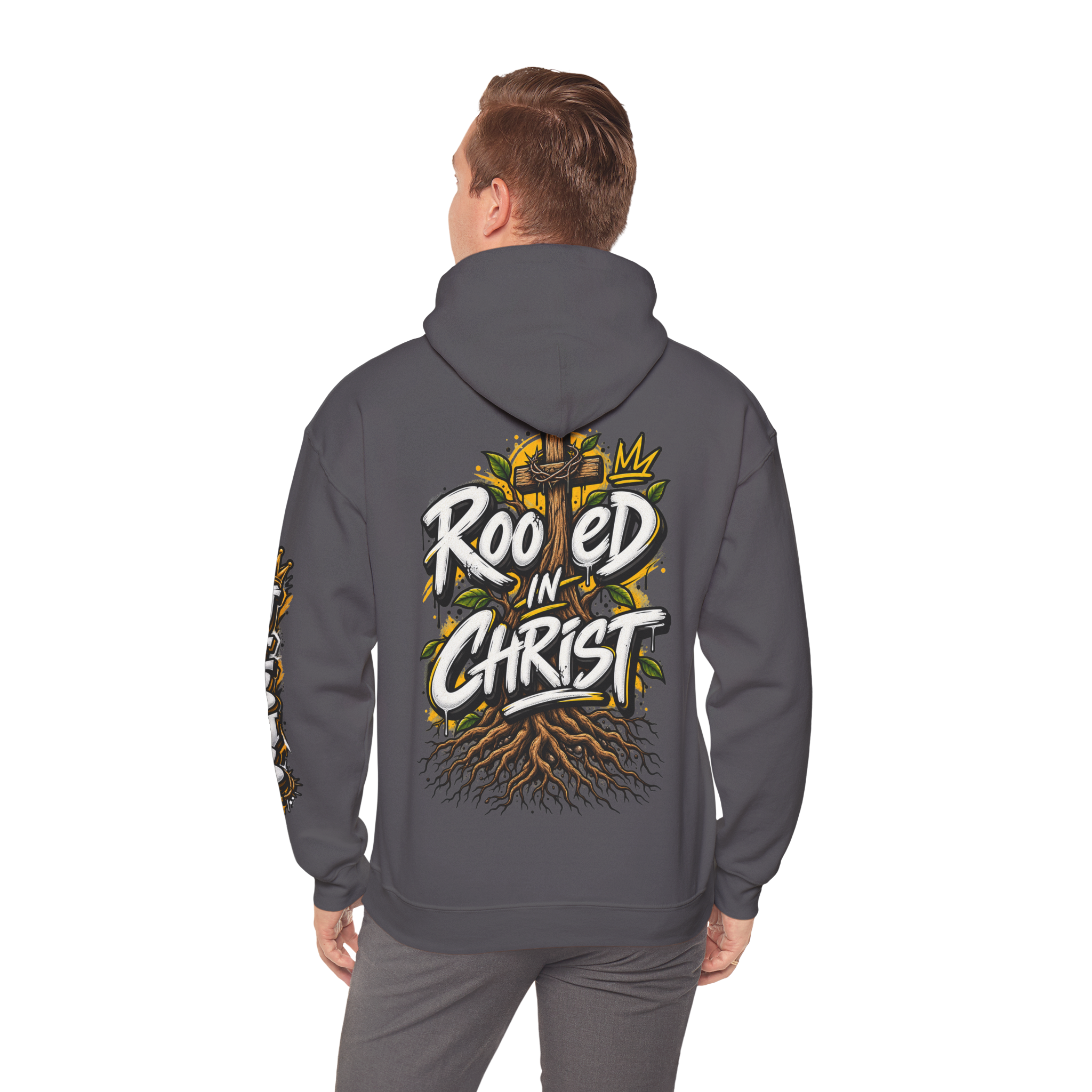 Unisex black hoodie featuring a vibrant graffiti-style 'Rooted in Christ' design with a cross, tree roots, and a crown.