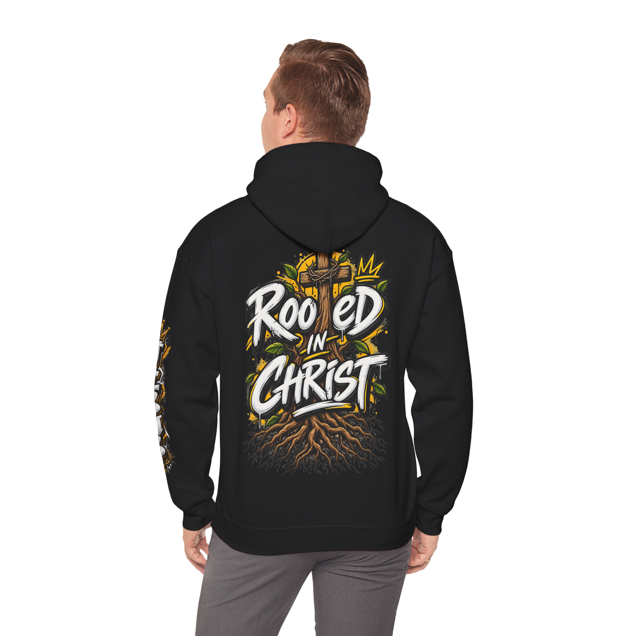 Unisex black hoodie featuring a vibrant graffiti-style 'Rooted in Christ' design with a cross, tree roots, and a crown.
