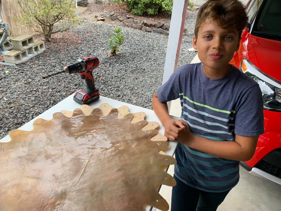 Rowan: Sámi Drum: Now in Birthing Ceremony, Rowan learns how to make holes in Buffalo’s prepared Mesa, to ready for lacing.