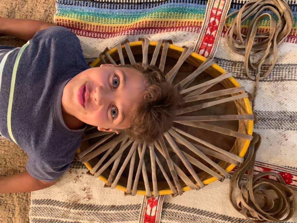 Rowan: Sámi Drum: Showing the beauty of the lacing on the back of the Mesa, Rowan rests in the center of the Altar with his Drum.