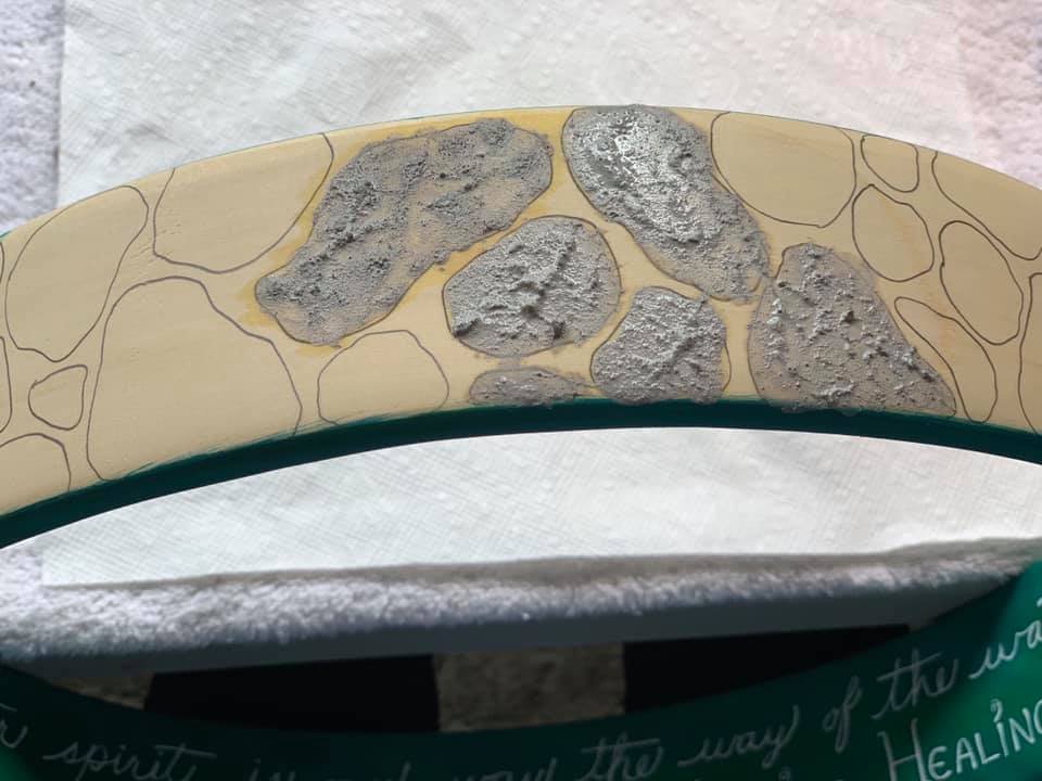 Owl Clan: Water Healing Drum: Starting with ash from the Sacred Sweat Lodge Fire, layering the rocks that will hold the structure of the Sacred Well.