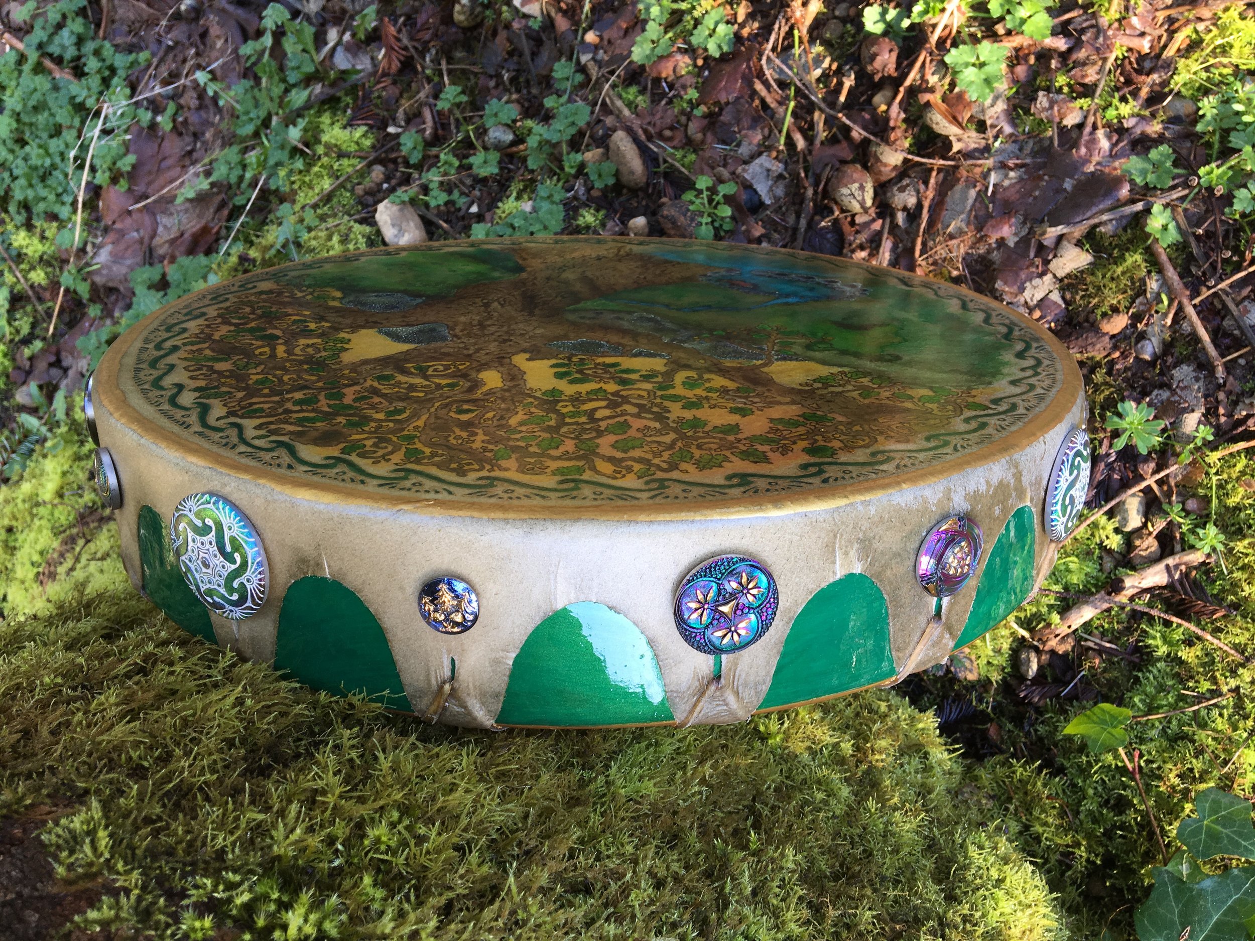 Jeannie's "Blessings of Brighid" Drum, with 16 Czech glass buttons all around the outer Sacred Circle.