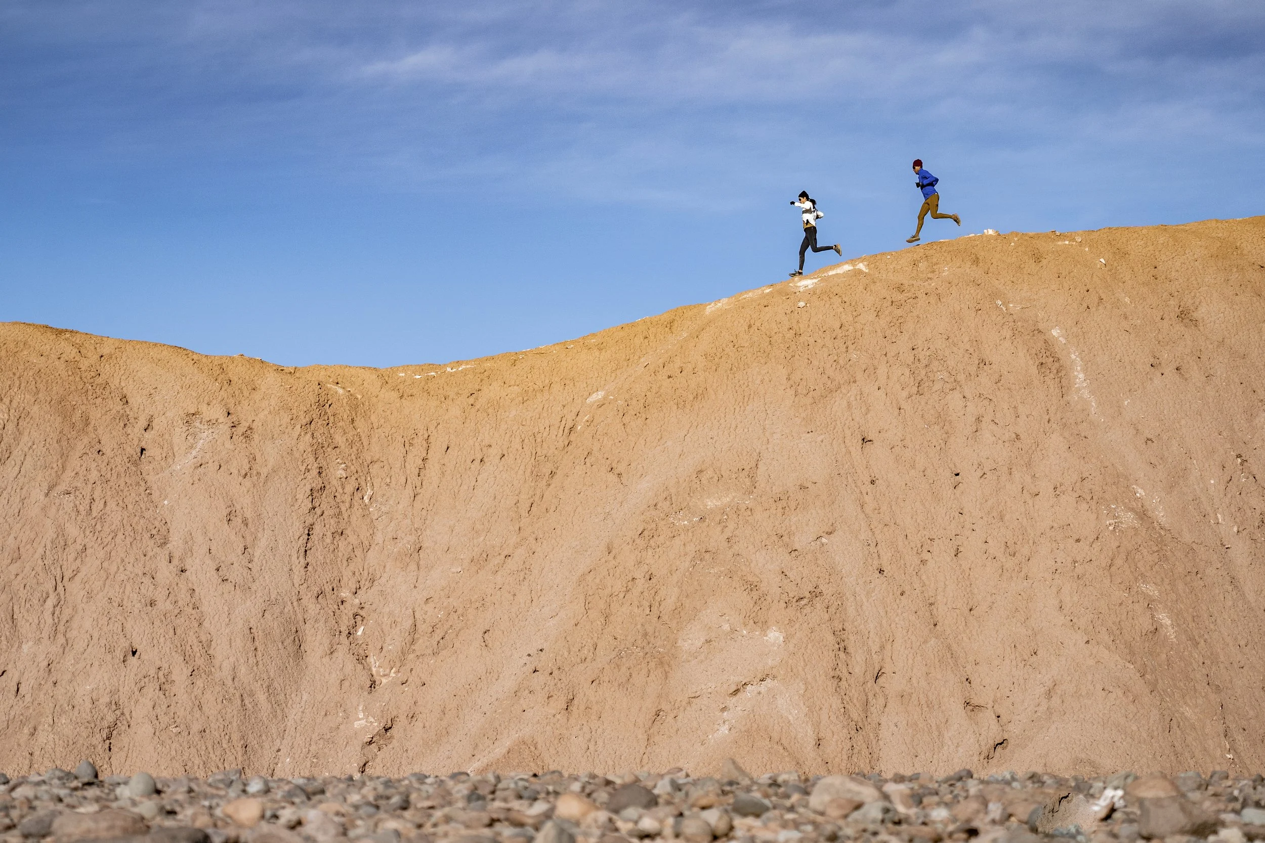 Janji performance running apparel showcased during an outdoor run, highlighting technical gear designed for endurance, comfort, and purpose-driven storytelling.