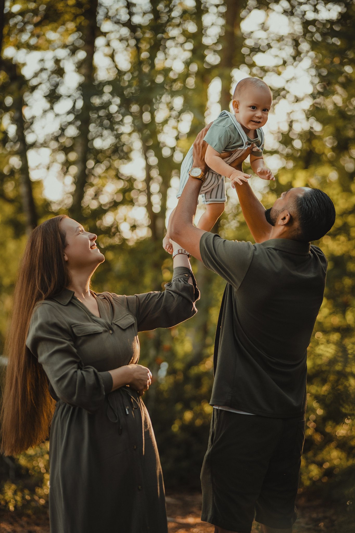 Family Portrait with baby on summer evening at golden hour