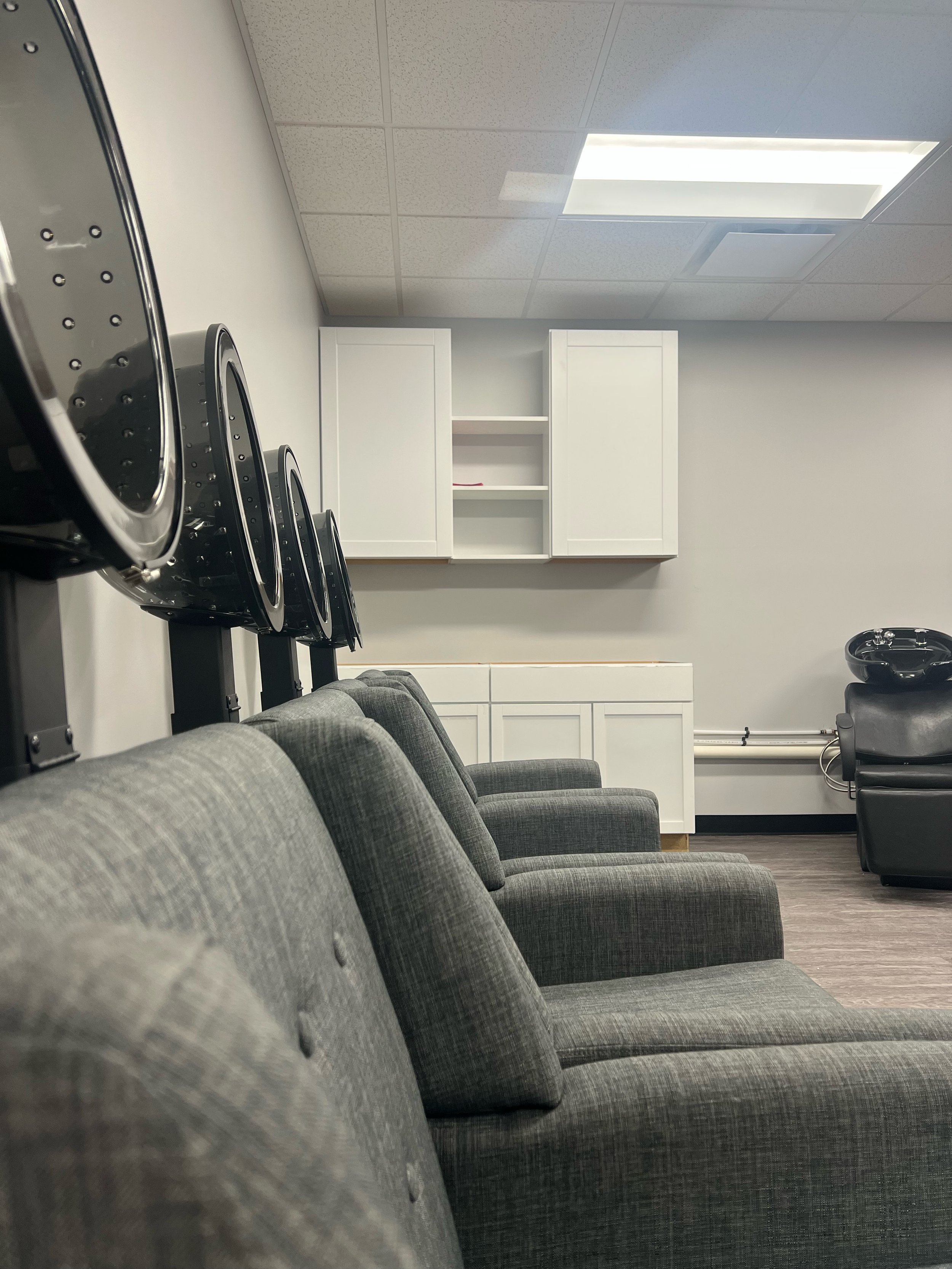 Inside our shared shampoo bowl and hair dryer room (featured tenant amenity).