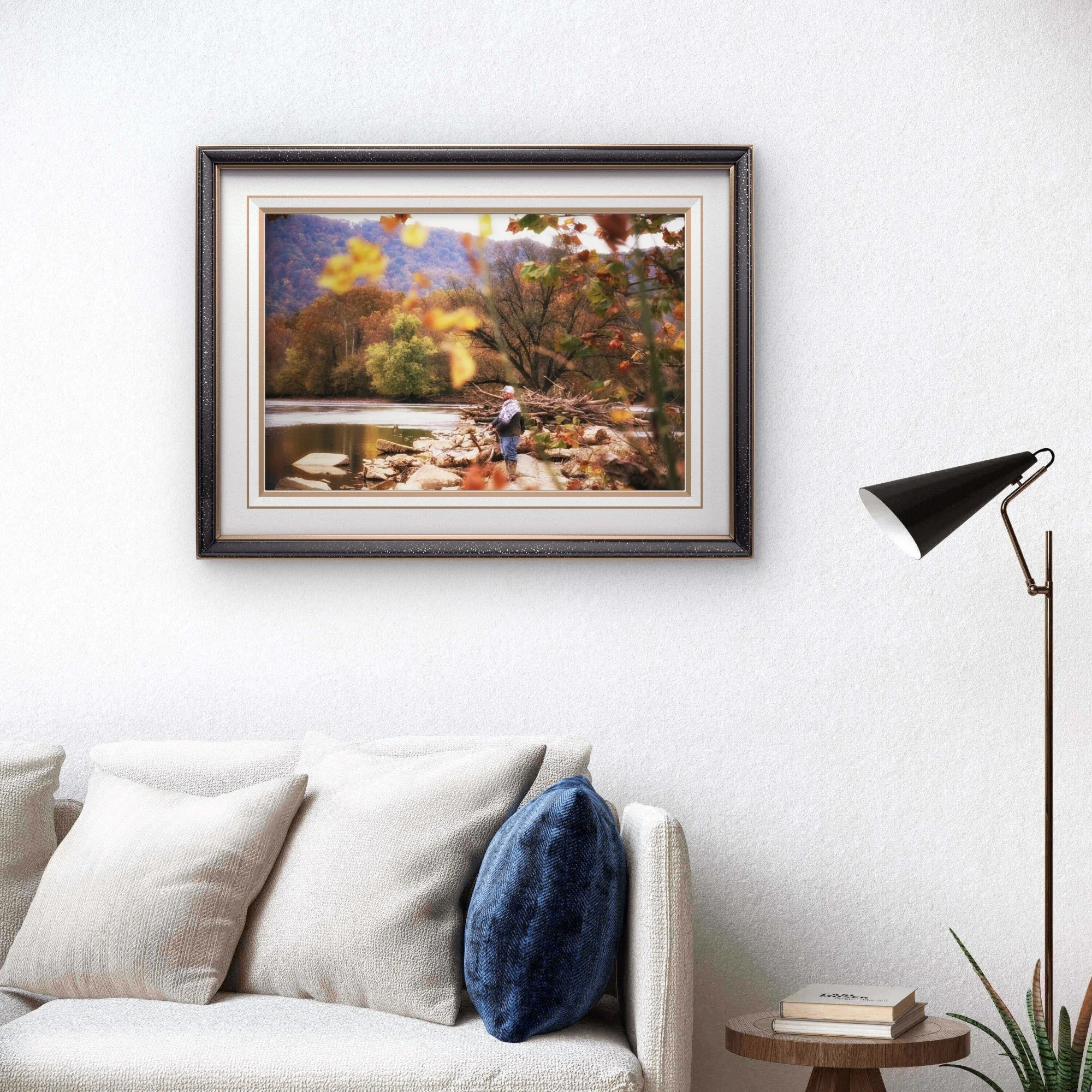 Autumn riverbank scene with a lone fisherman among rocks and fall foliage, photographed in Appalachia by Yevette Lynn, fine art photography